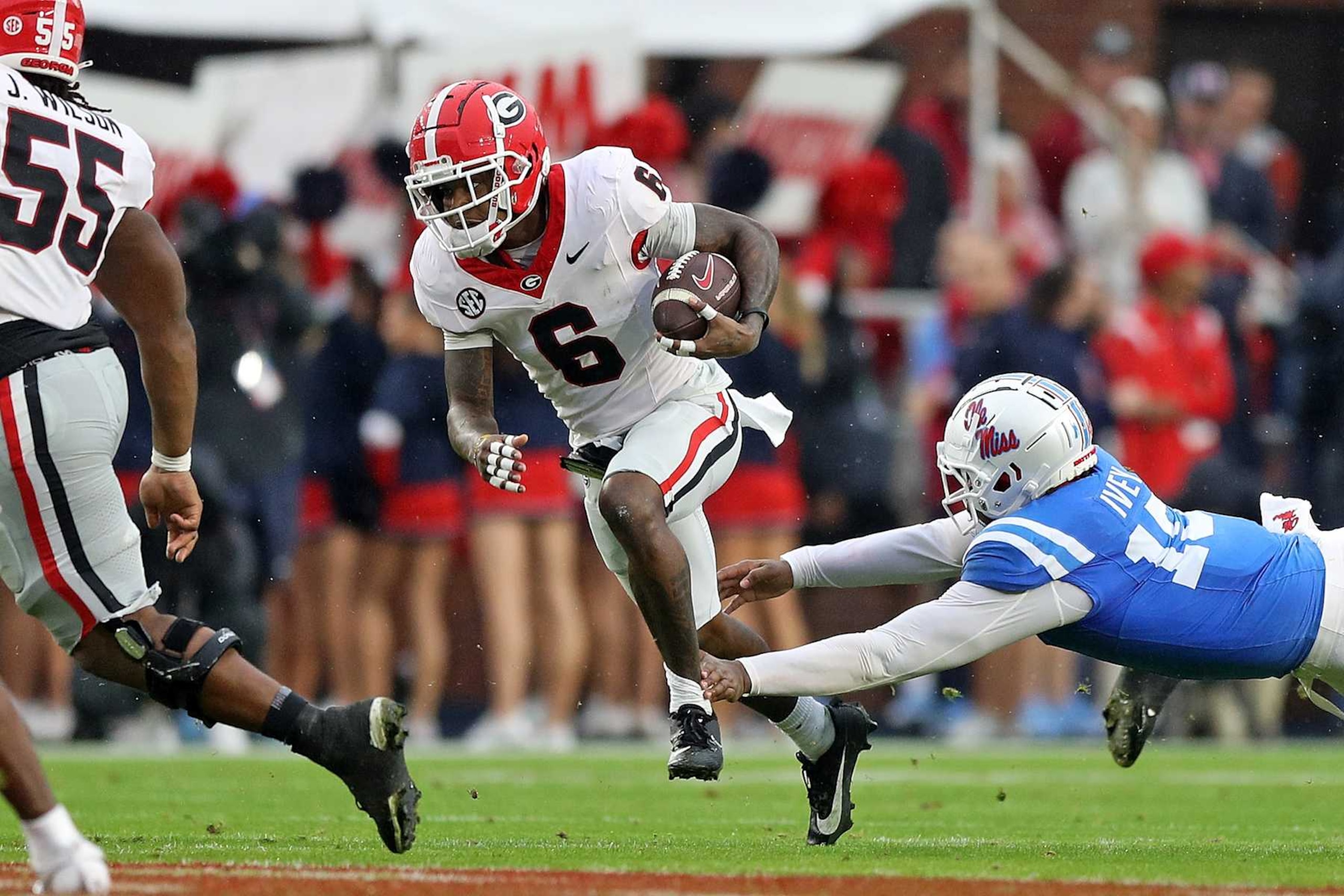 OXFORD, MISSISSIPPI - NOVEMBER 09: Dominic Lovett #6 of the Georgia Bulldogs carries the ball during the first half against Jared Ivey #15 of the Mississippi Rebels during the first half at Vaught-Hemingway Stadium on November 09, 2024 in Oxford, Mississippi. (Photo by Justin Ford/Getty Images) OXFORD, MISSISSIPPI - NOVEMBER 09: Dominic Lovett #6 of the Georgia Bulldogs carries the ball during the first half against Jared Ivey #15 of the Mississippi Rebels during the first half at Vaught-Hemingway Stadium on November 09, 2024 in Oxford, Mississippi. (Photo by Justin Ford/Getty Images)