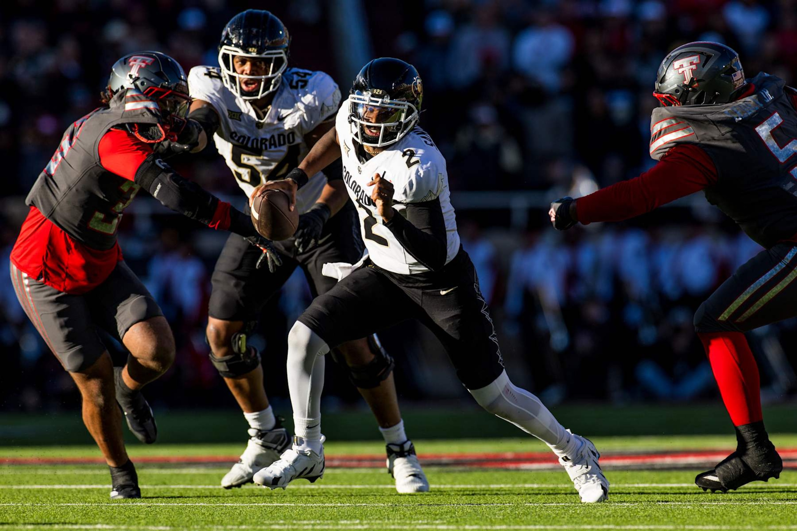 LUBBOCK, TEXAS - NOVEMBER 09: Shedeur Sanders #2 of the Colorado Buffaloes runs the ball during the first half of the game against the Texas Tech Red Raiders at Jones AT&T Stadium on November 09, 2024 in Lubbock, Texas. (Photo by John E. Moore III/Getty Images)