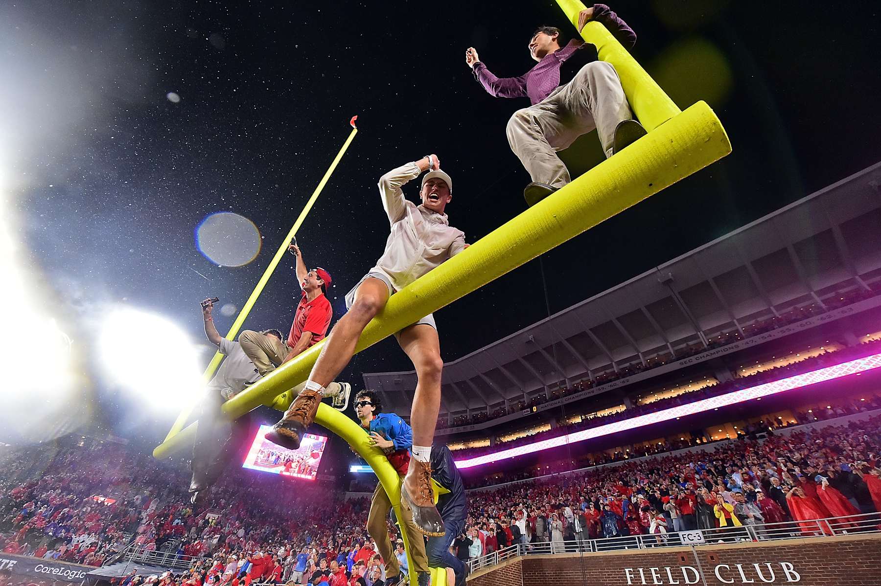 OXFORD, MISSISSIPPI - NOVEMBER 09: Fans sit atop the field goal after the game between the Mississippi Rebels and the Georgia Bulldogs at Vaught-Hemingway Stadium on November 09, 2024 in Oxford, Mississippi. Ole Miss defeated Georgia 28-10. (Photo by Justin Ford/Getty Images)