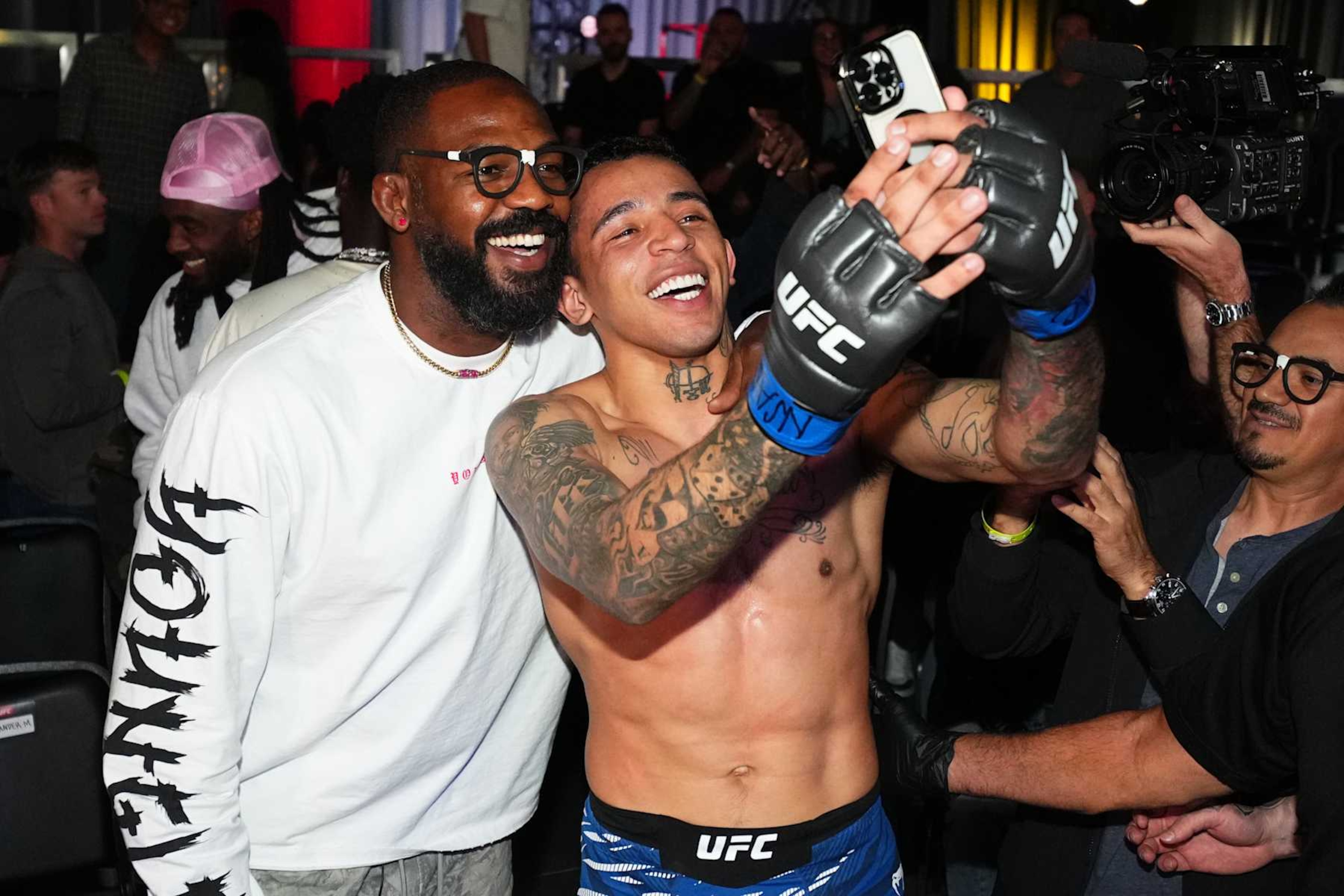 LAS VEGAS, NEVADA - NOVEMBER 09: Carlos Prates of Brazil poses with Jon Jones after a knockout victory against Neil Magny in a welterweight fight during the UFC Fight Night event at UFC APEX on November 09, 2024 in Las Vegas, Nevada. (Photo by Chris Unger/Zuffa LLC)