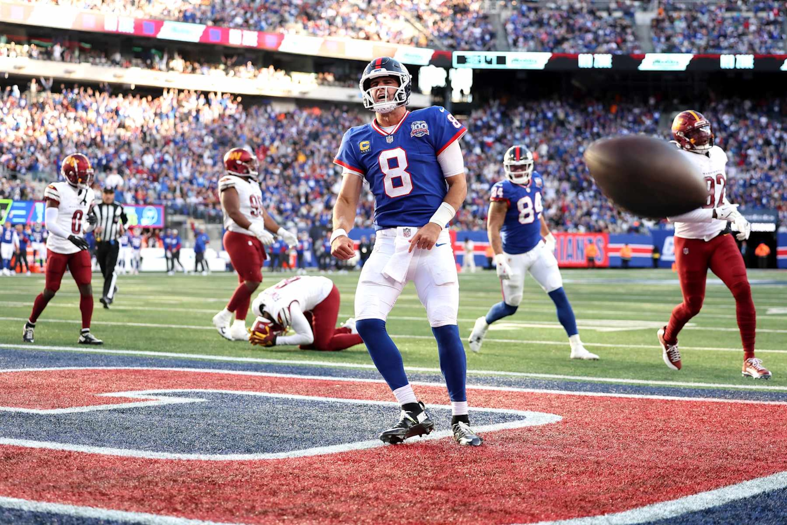 EAST RUTHERFORD, NEW JERSEY - NOVEMBER 03: Daniel Jones #8 of the New York Giants celebrates a touchdown during the fourth quarter against the Washington Commanders at MetLife Stadium on November 03, 2024 in East Rutherford, New Jersey. (Photo by Luke Hales/Getty Images)