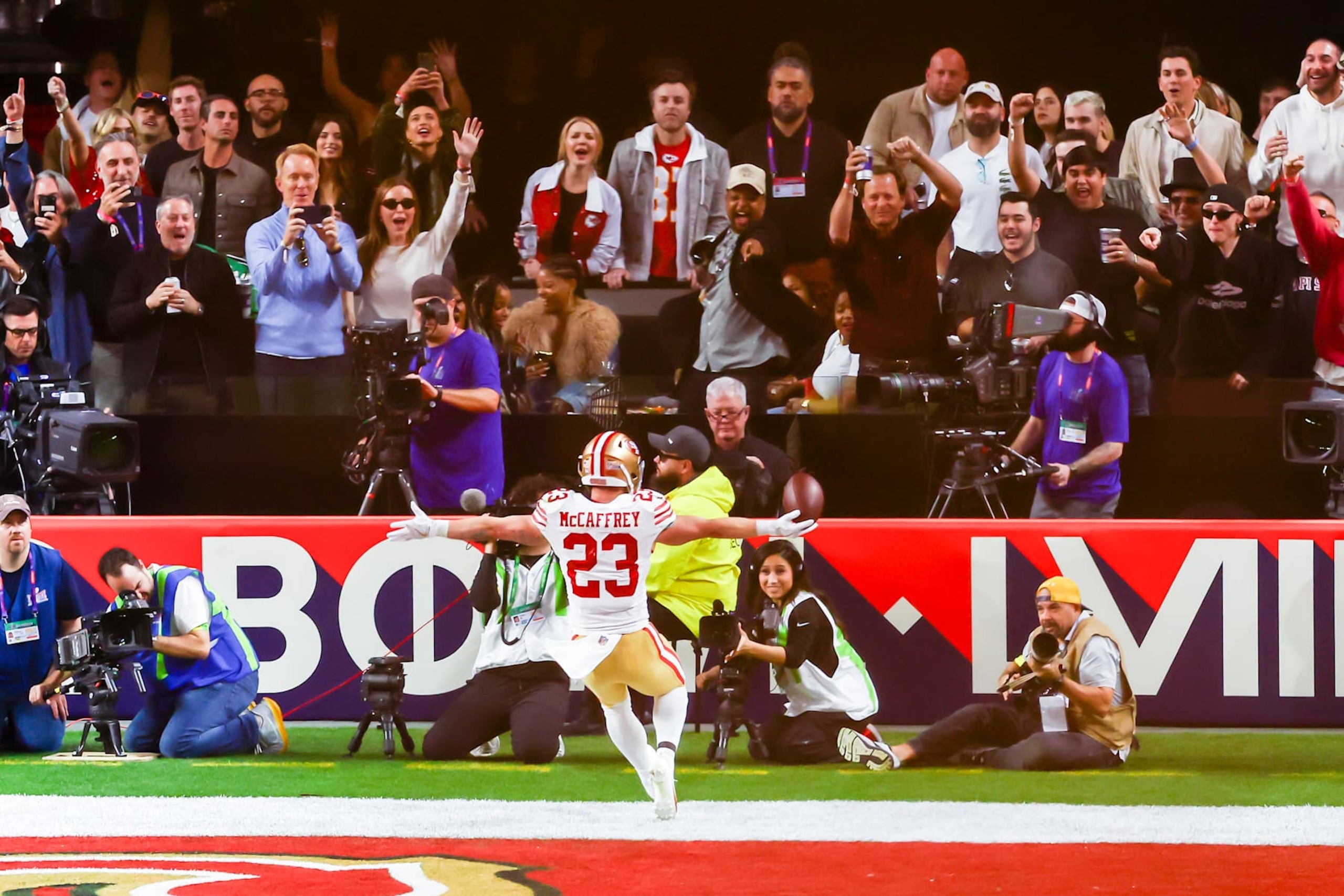 LAS VEGAS, NV - FEBRUARY 11: San Francisco 49ers running back Christian McCaffrey (23) runs towards celebrating fans after a touchdown during Super Bowl LVIII between the Kansas City Chiefs and the San Francisco 49ers on Sunday February 11, 2024 at Allegiant Stadium in Las Vegas, NV.  (Photo by Nick Tre. Smith/Icon Sportswire via Getty Images)