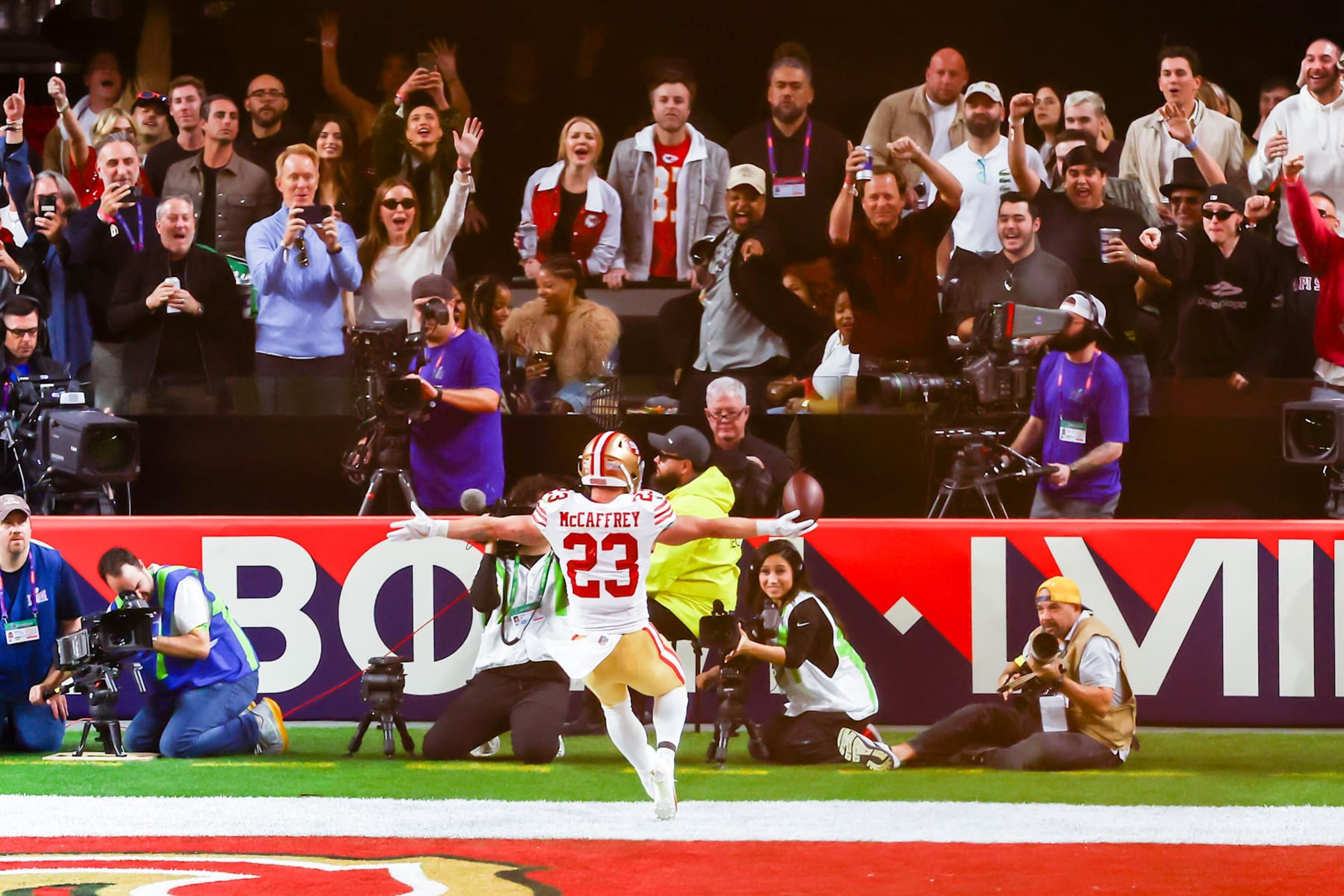 LAS VEGAS, NV - FEBRUARY 11: San Francisco 49ers running back Christian McCaffrey (23) runs towards celebrating fans after a touchdown during Super Bowl LVIII between the Kansas City Chiefs and the San Francisco 49ers on Sunday February 11, 2024 at Allegiant Stadium in Las Vegas, NV.  (Photo by Nick Tre. Smith/Icon Sportswire via Getty Images)