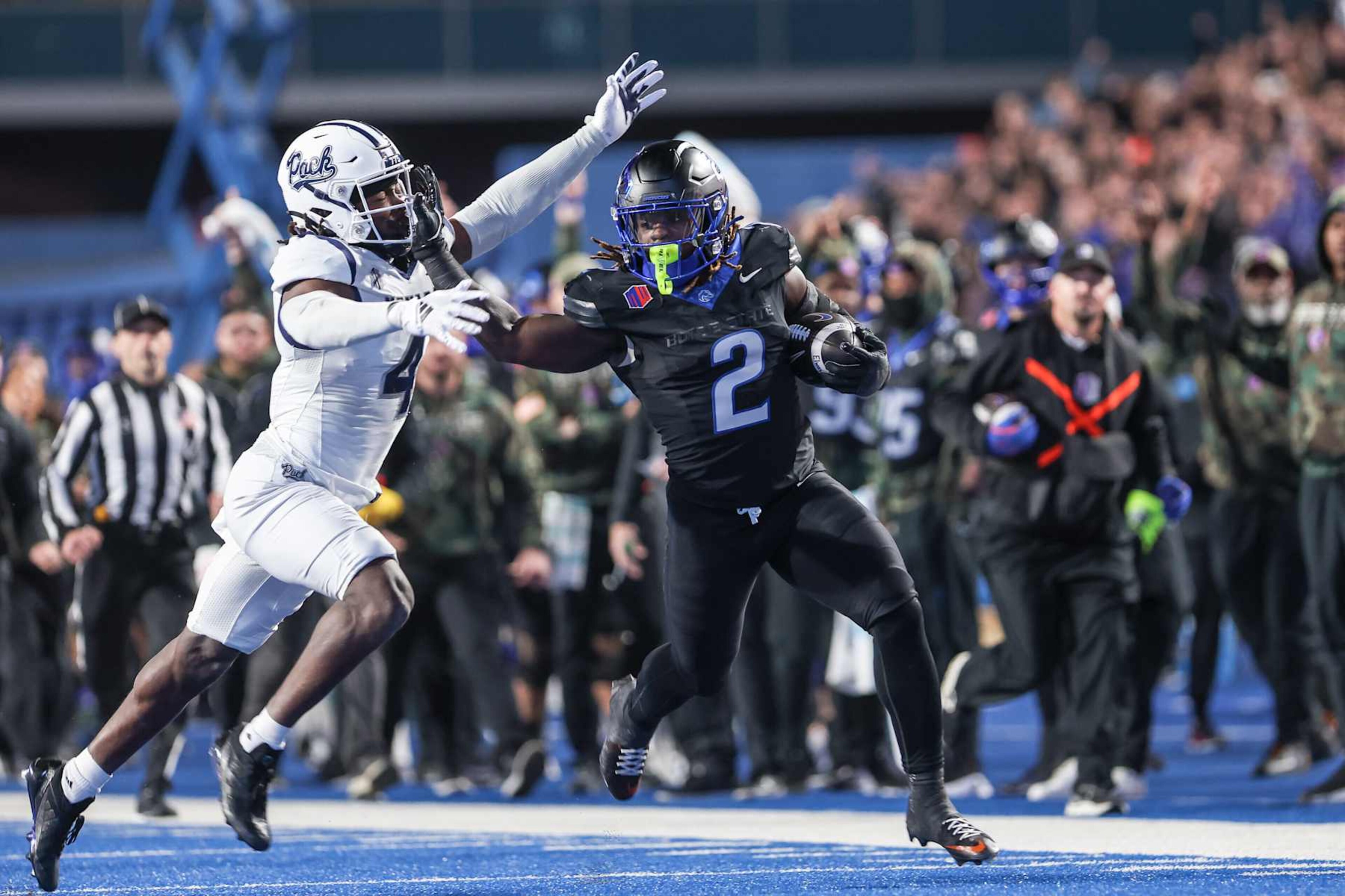 BOISE, ID - NOVEMBER 9: Running back Ashton Jeanty #2 of the Boise State Broncos pushes off the tackle of safety Kitan Crawford #4 of the Nevada Wolf Pack during the first half at Albertsons Stadium on November 9, 2024 in Boise, Idaho. (Photo by Loren Orr/Getty Images) BOISE, ID - NOVEMBER 9: Running back Ashton Jeanty #2 of the Boise State Broncos pushes off the tackle of safety Kitan Crawford #4 of the Nevada Wolf Pack during the first half at Albertsons Stadium on November 9, 2024 in Boise, Idaho. (Photo by Loren Orr/Getty Images)