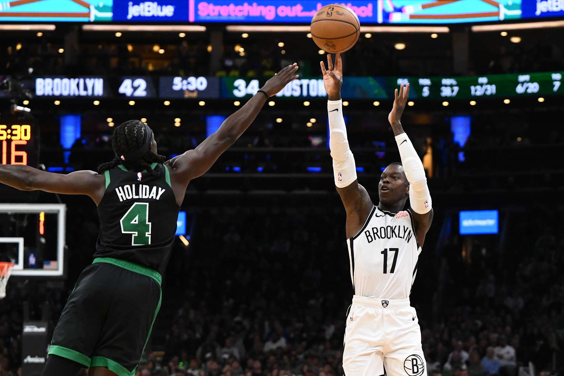 BOSTON, MASSACHUSETTS - NOVEMBER 08: Dennis Schroder #17 of the Brooklyn Nets attempts a basket against Jrue Holiday #4 of the Boston Celtics during the second quarter at the TD Garden on November 08, 2024 in Boston, Massachusetts. NOTE TO USER: User expressly acknowledges and agrees that, by downloading and or using this photograph, User is consenting to the terms and conditions of the Getty Images License Agreement. (Photo by Brian Fluharty/Getty Images)