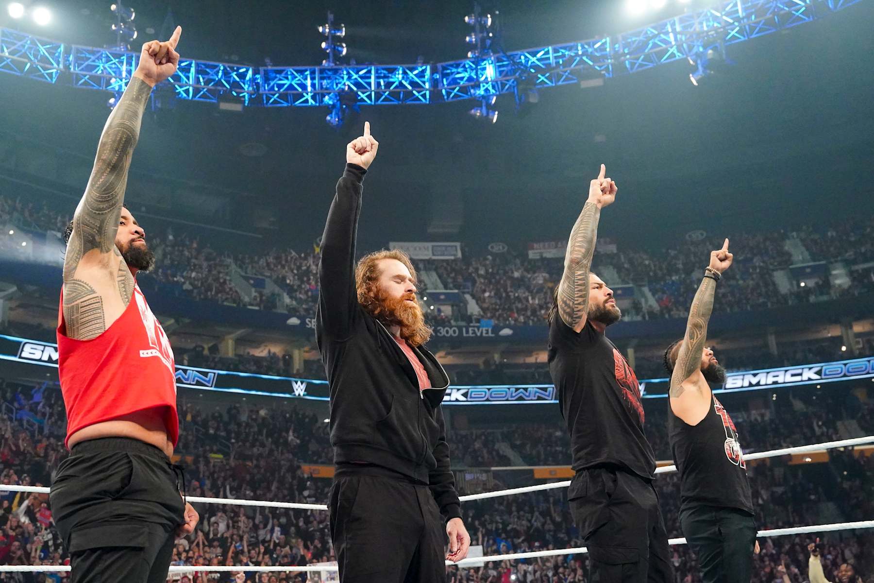 BUFFALO, NEW YORK - NOVEMBER 8: Jey uso, Sammi Zayn, Roman Reigns, Jimmy Uso do their signature pose during Friday night Smackdown at KeyBank Center on November 8, 2024 in Buffalo, New York.  (Photo by WWE/Getty Images)