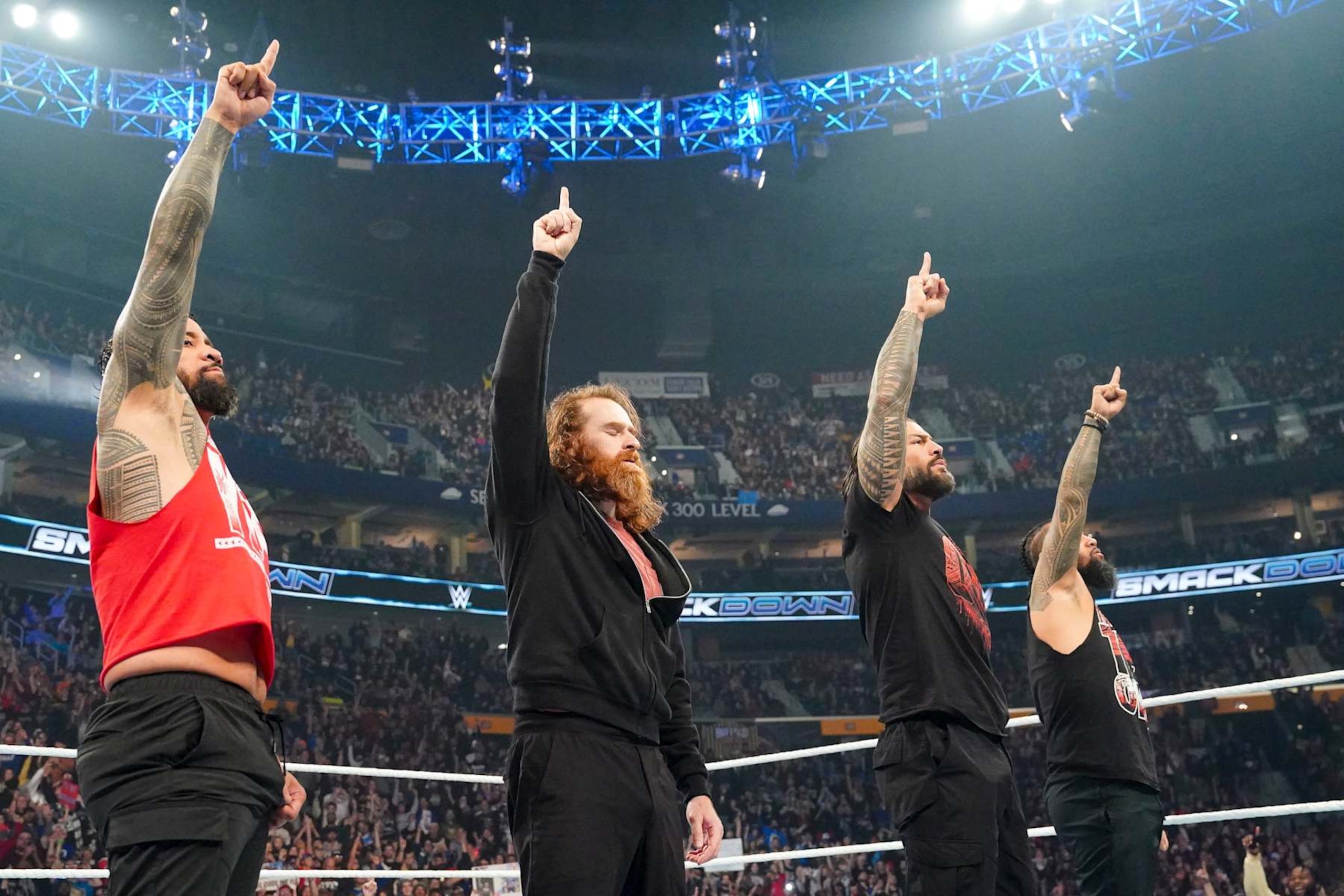 BUFFALO, NEW YORK - NOVEMBER 8: Jey uso, Sammi Zayn, Roman Reigns, Jimmy Uso do their signature pose during Friday night Smackdown at KeyBank Center on November 8, 2024 in Buffalo, New York.  (Photo by WWE/Getty Images)