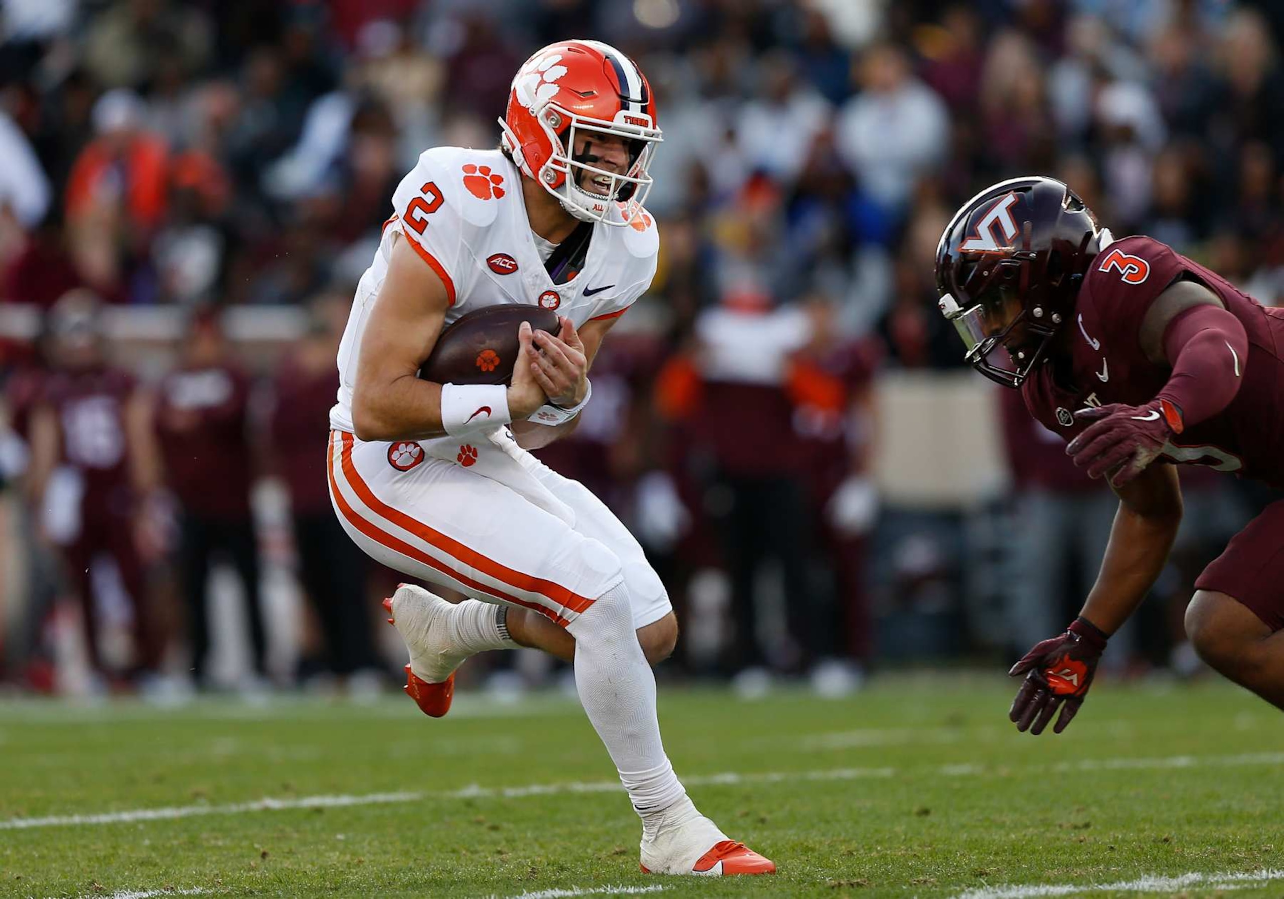 BLACKSBURG, VA - NOVEMBER 09: Clemson Tigers quarterback Cade Klubnik (2) rushes upfield attempting to evade Virginia Tech Hokies linebacker Sam Brumfield (3) during a college football game between the Clemson Tigers and the Virginia Tech Hokies on November 9, 2024, at Lane Stadium in Blacksburg, VA. (Photo by Lee Coleman/Icon Sportswire via Getty Images)