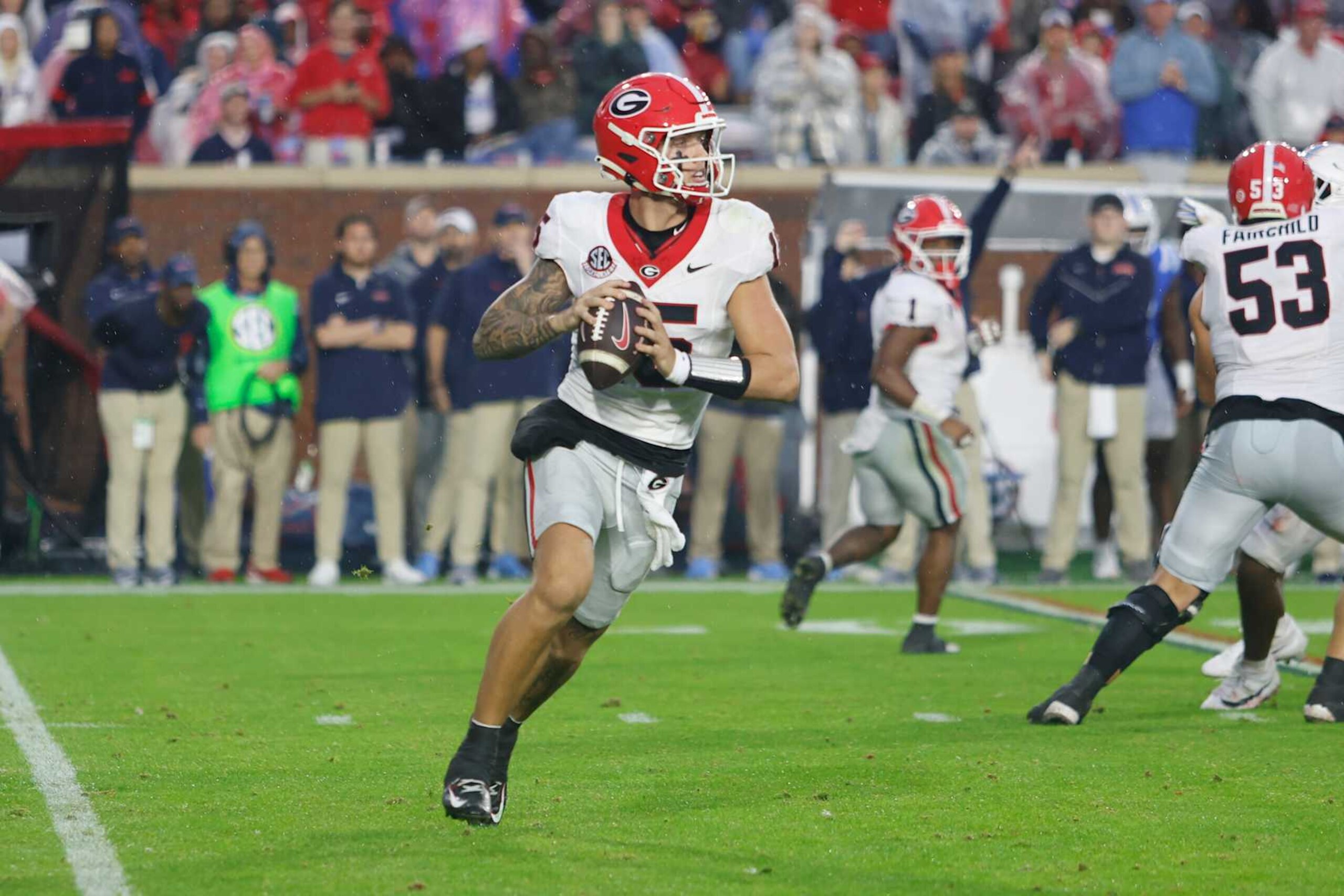 OXFORD, MS - NOVEMBER 09:  Georgia Bulldogs quarterback Carson Beck (15) rolls out of the pocket to pass during the college football game between Georgia Bulldogs and Ole Miss Rebels on November 9, 2024, at Vaught-Hemingway Stadium in Oxford, Mississippi. (Photo by Andy Altenburger/Icon Sportswire via Getty Images)