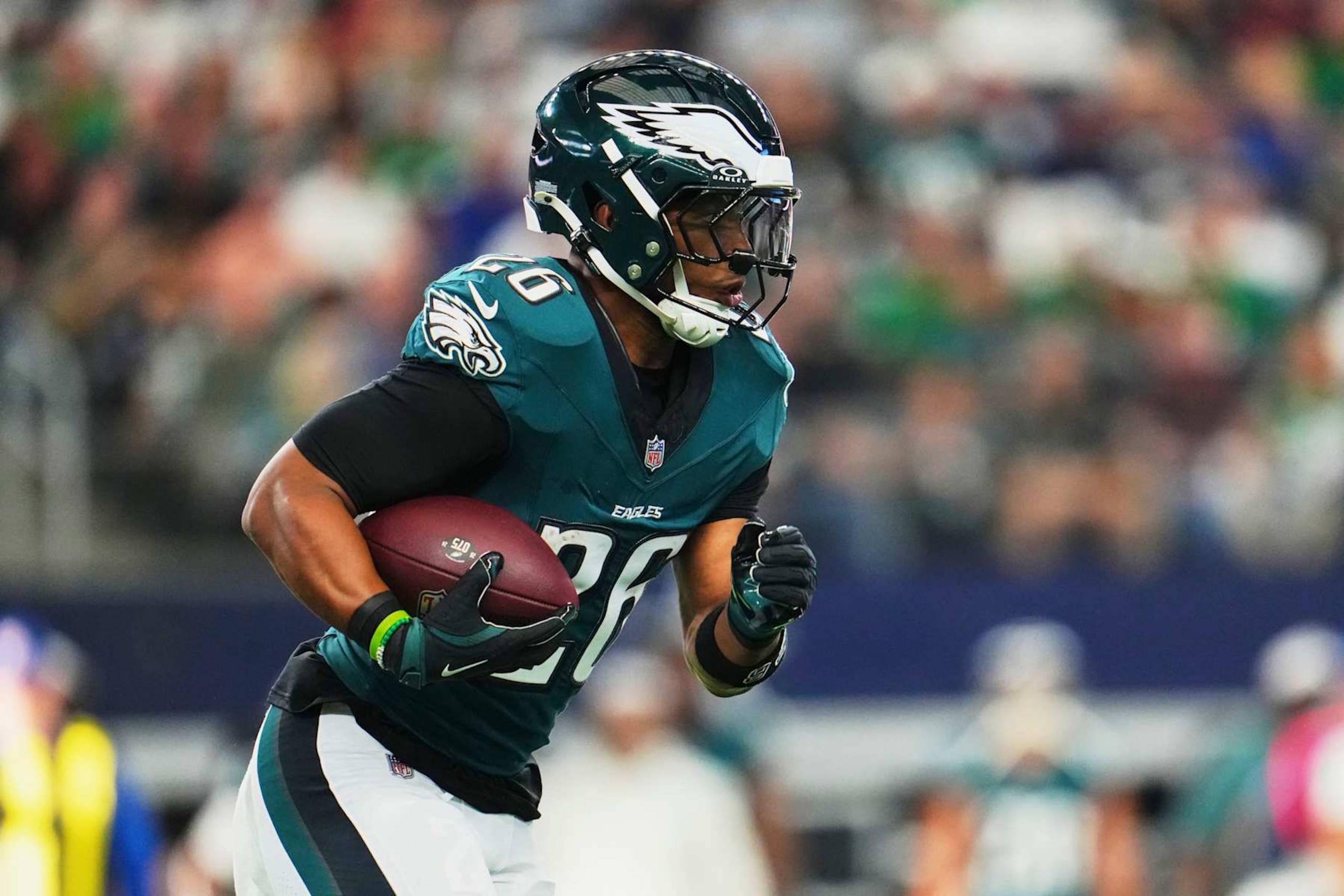 ARLINGTON, TX - NOVEMBER 10: Saquon Barkley #26 of the Philadelphia Eagles carries the ball against the Dallas Cowboys during the first half of an NFL football game at AT&T Stadium on November 10, 2024 in Arlington, Texas. (Photo by Cooper Neill/Getty Images)
