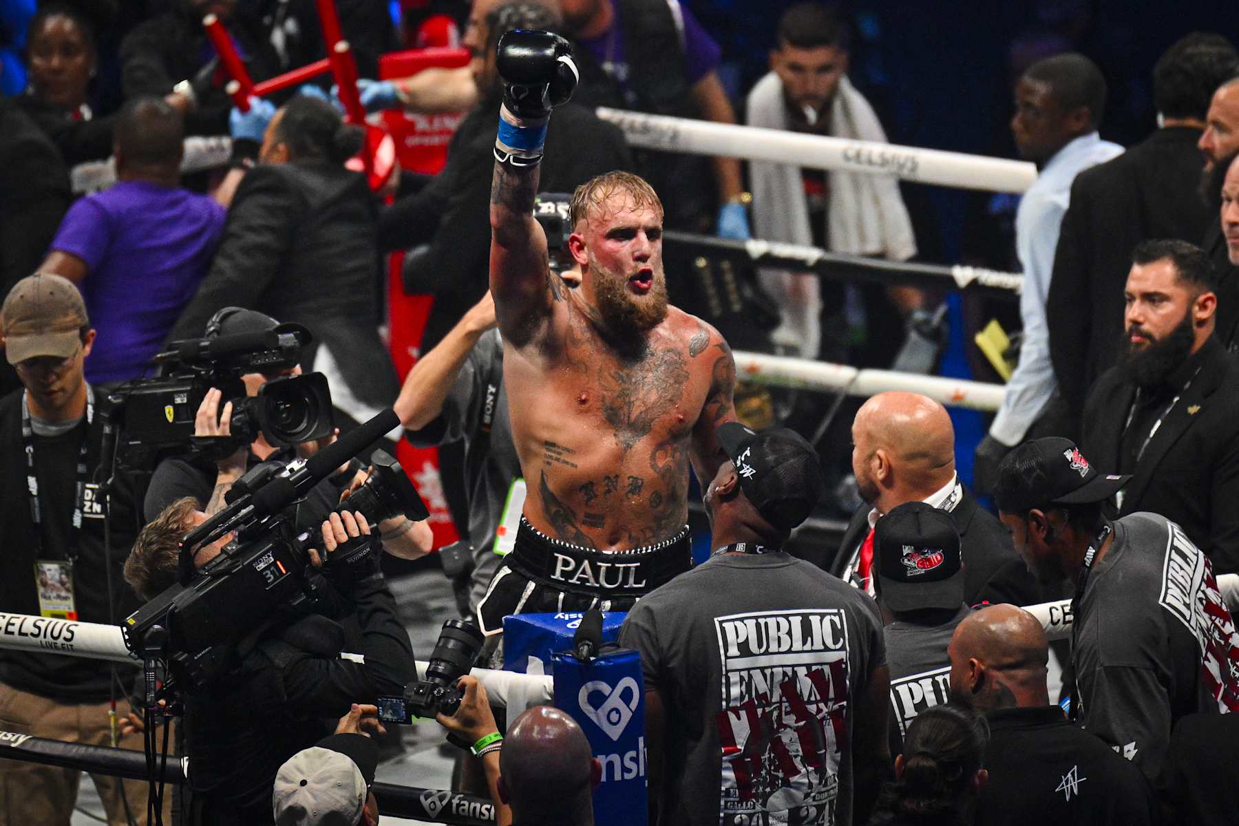 Jake Paul celebrates after defeating Mike Perry