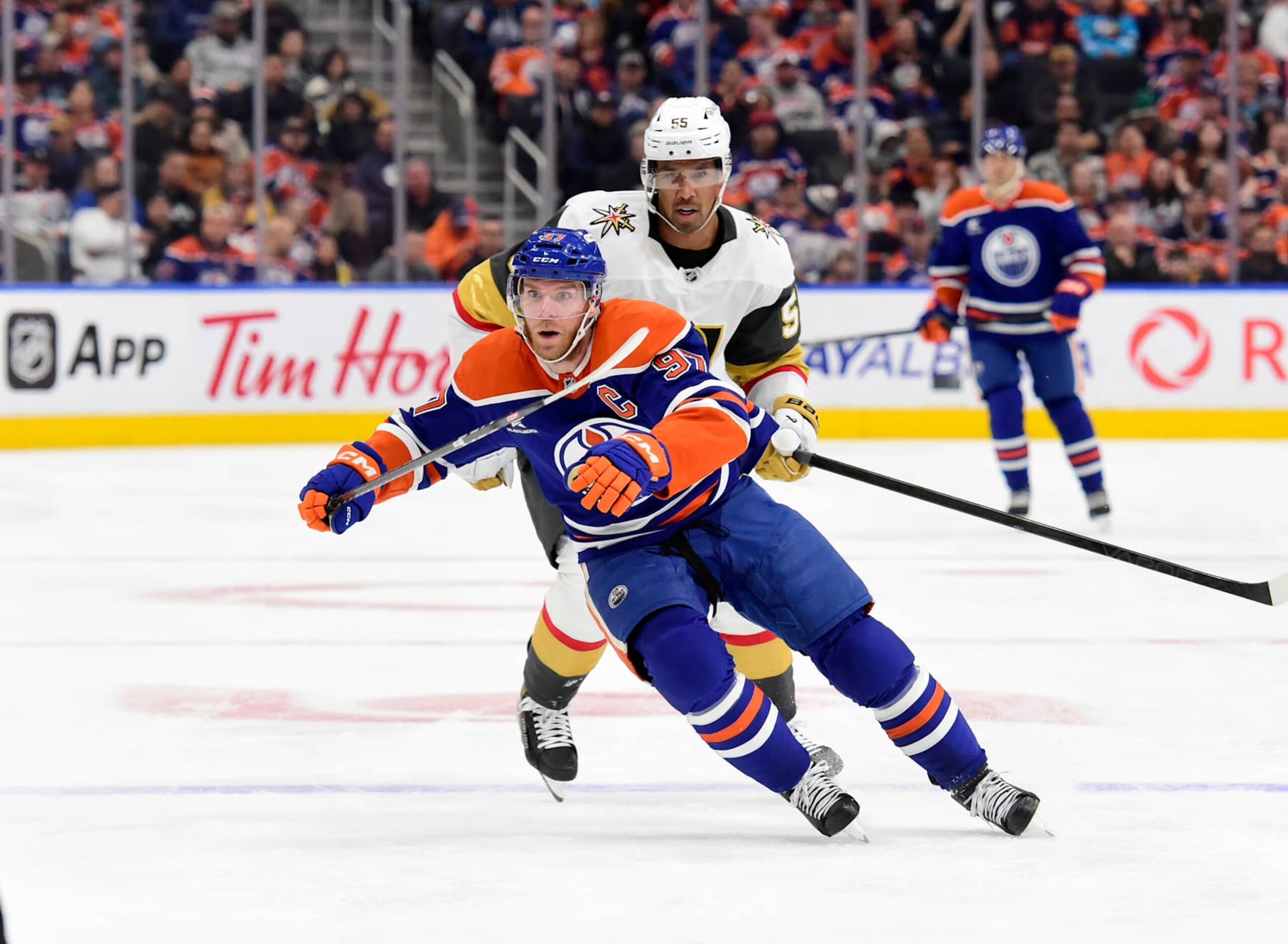 EDMONTON, CANADA  NOVEMBER 6: Connor McDavid #97 of the Edmonton Oilers skates against Keegan Kolesar #55 of the Vegas Golden Knights during the second period at Rogers Place on November 6, 2024, in Edmonton, Alberta, Canada. (Photo by Leila Devlin/Getty Images)