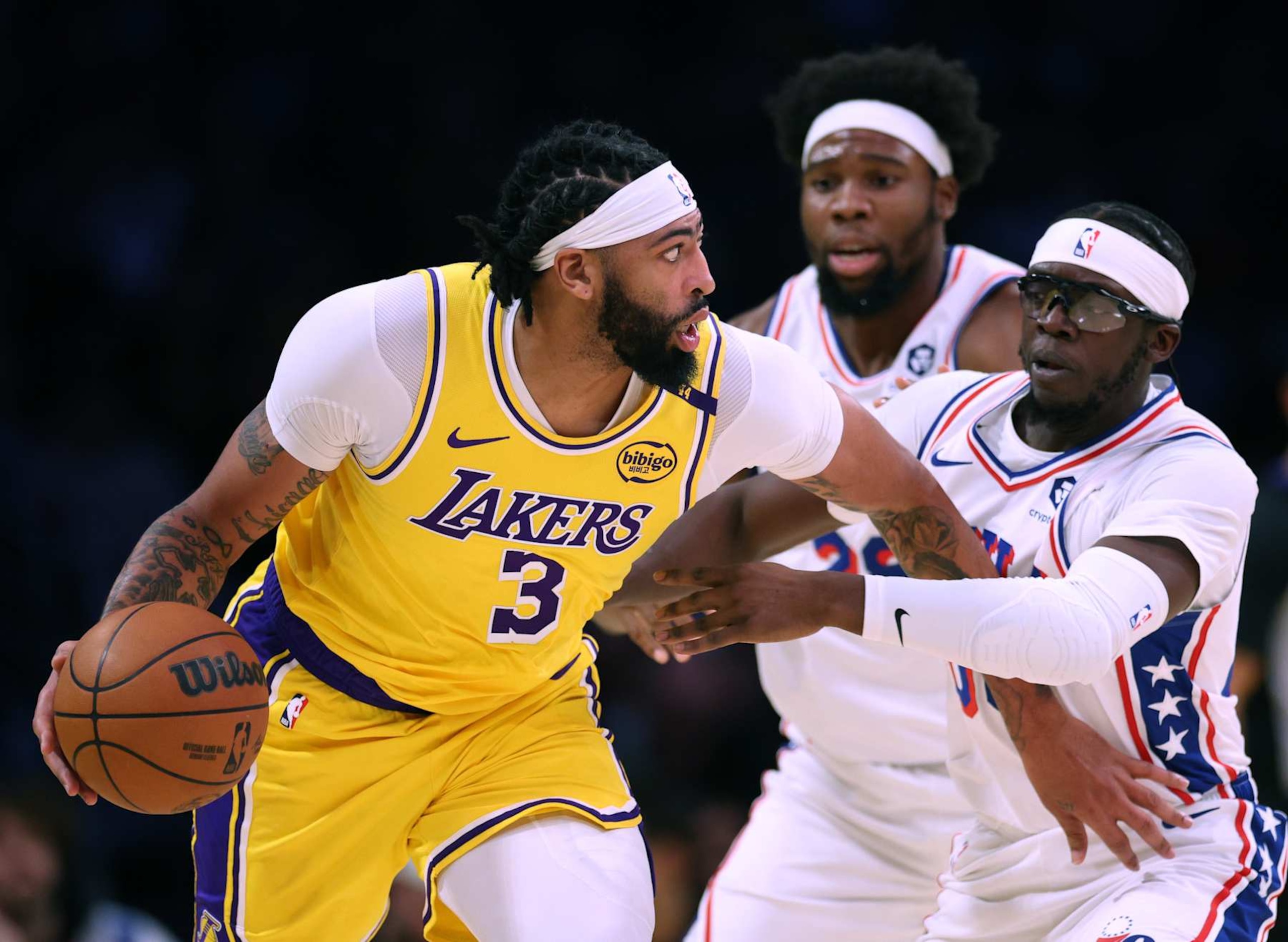 LOS ANGELES, CALIFORNIA - NOVEMBER 08: Anthony Davis #3 of the Los Angeles Lakers dribbles in front of Reggie Jackson #00 and Guerschon Yabusele #28 of the Philadelphia 76ers during a 116-106 Lakers win at Crypto.com Arena on November 08, 2024 in Los Angeles, California. (Photo by Harry How/Getty Images) NOTE TO USER: User expressly acknowledges and agrees that, by downloading and/or using this Photograph, user is consenting to the terms and conditions of the Getty Images License Agreement. (Photo by Harry How/Getty Images)