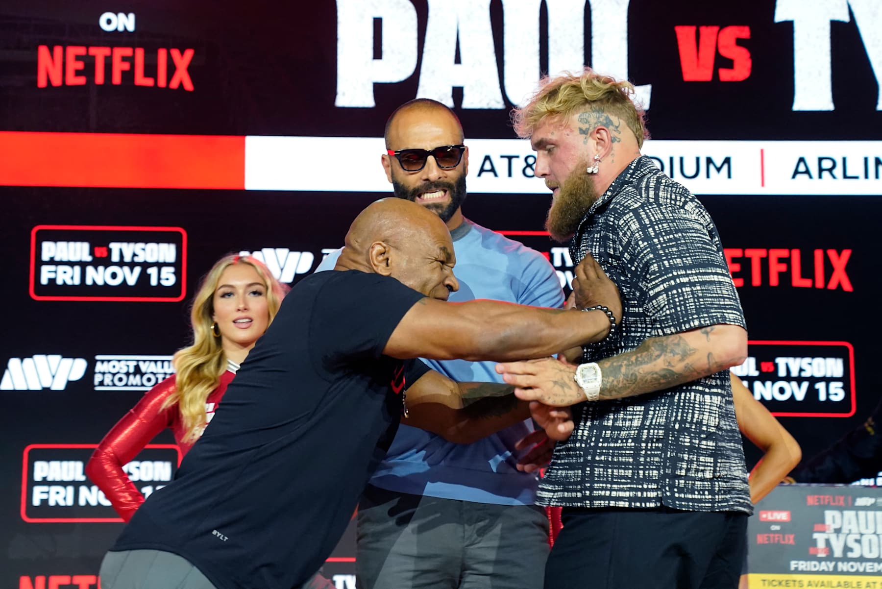(L-R) Former US heavyweight boxing champion Mike Tyson and US YouTuber and boxer Jake Paul face off during a press conference at Fanatics Fest NYC on August 18, 2024, in New York City. The heavyweight match has been rescheduled for November 15, 2024, and will take place in Arlington, Texas. (Photo by TIMOTHY A. CLARY / AFP) (Photo by TIMOTHY A. CLARY/AFP via Getty Images)