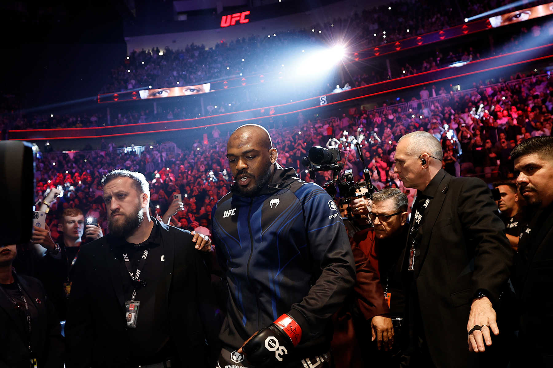 Jon Jones walks to the Octagon to fight Ciryl Gane in March, 2023. 