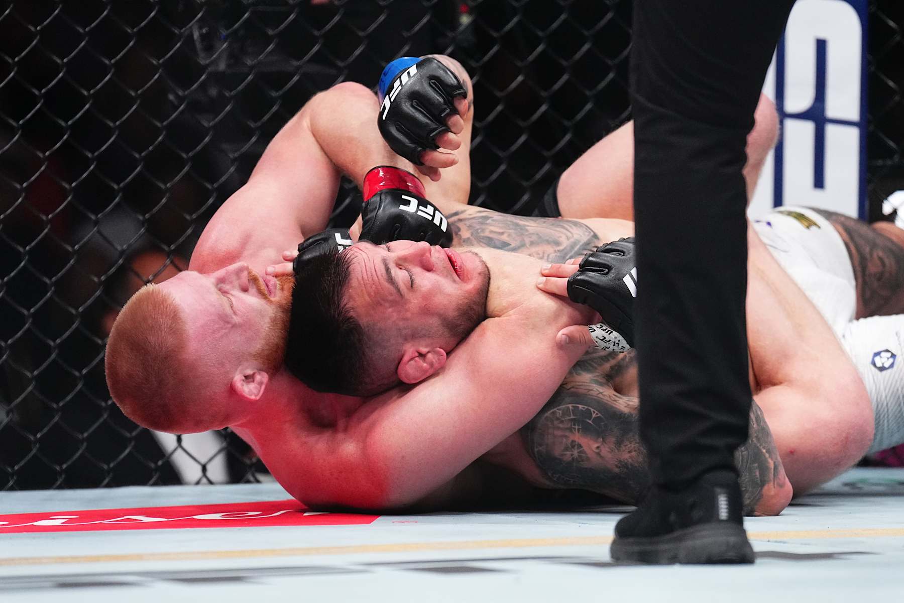 Bo Nickal attacks a rear-naked choke against Cody Brundage