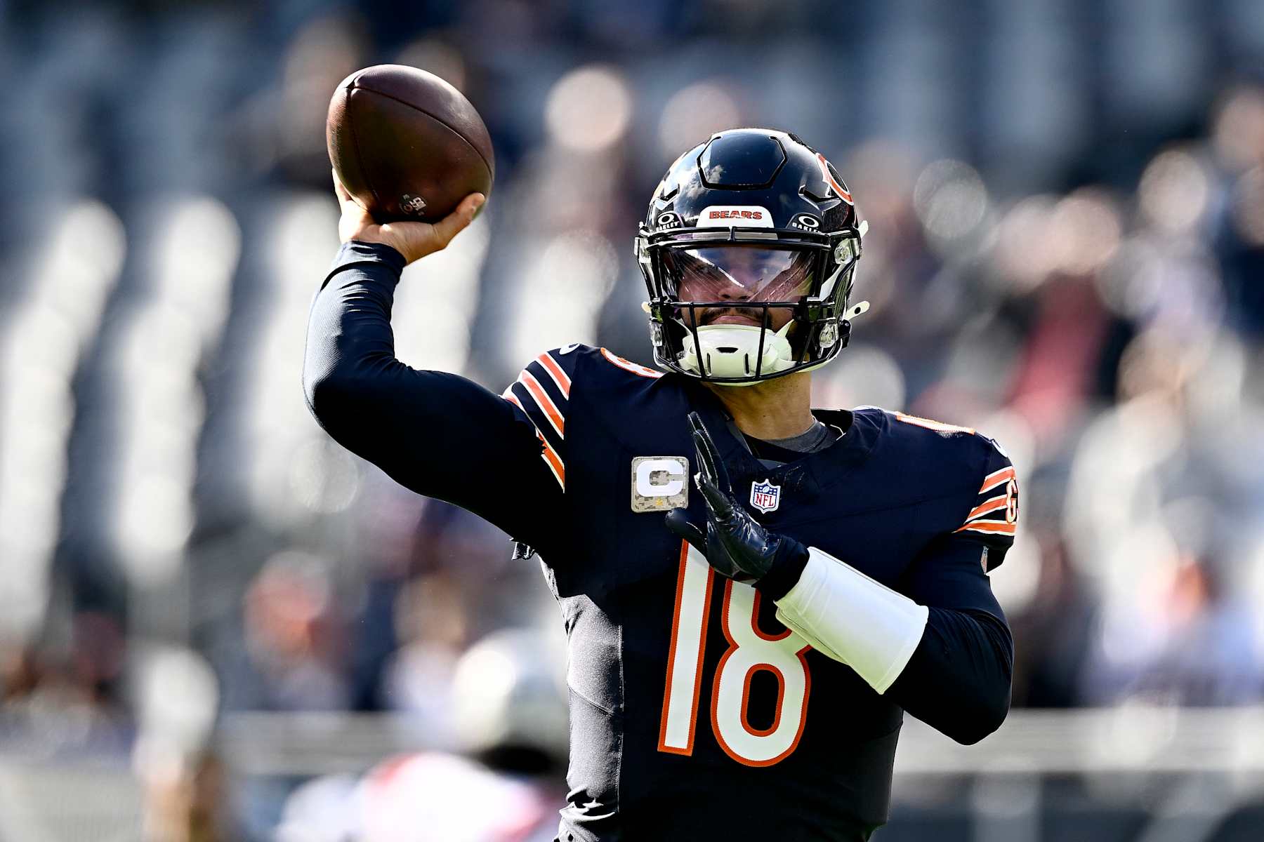 CHICAGO, ILLINOIS - NOVEMBER 10: Caleb Williams #18 of the Chicago Bears warms up before the game against the New England Patriots at Soldier Field on November 10, 2024 in Chicago, Illinois. (Photo by Quinn Harris/Getty Images)