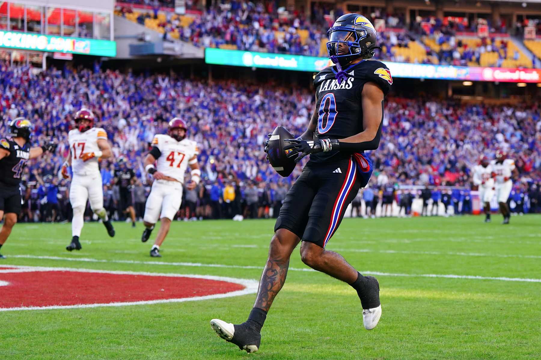 KANSAS CITY, MISSOURI - NOVEMBER 9: Wide receiver Quentin Skinner #0 of the Kansas Jayhawks scores a touchdown against the Iowa State Cyclones during the second quarter at Arrowhead Stadium on November 9, 2024 in Kansas City, Missouri.  (Photo by Kyle Rivas/Getty Images)