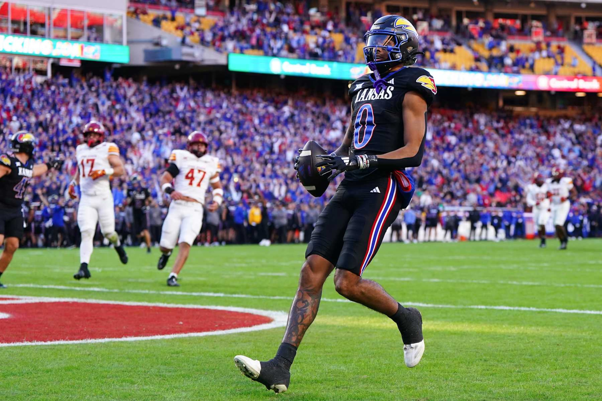 KANSAS CITY, MISSOURI - NOVEMBER 9: Wide receiver Quentin Skinner #0 of the Kansas Jayhawks scores a touchdown against the Iowa State Cyclones during the second quarter at Arrowhead Stadium on November 9, 2024 in Kansas City, Missouri.  (Photo by Kyle Rivas/Getty Images)