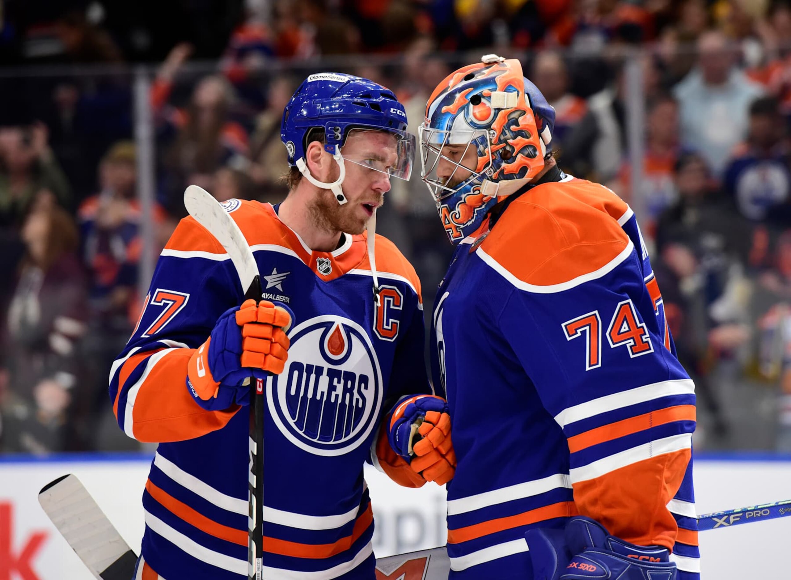 EDMONTON, CANADA OCTOBER 25: Connor McDavid #97 and Stuart Skinner #74 of the Edmonton Oilers celebrate a victory over the Pittsburgh Penguins after the game at Rogers Place on October 15, 2024, in Edmonton, Alberta, Canada. (Photo by Leila Devlin/Getty Images) EDMONTON, CANADA OCTOBER 25: Connor McDavid #97 and Stuart Skinner #74 of the Edmonton Oilers celebrate a victory over the Pittsburgh Penguins after the game at Rogers Place on October 15, 2024, in Edmonton, Alberta, Canada. (Photo by Leila Devlin/Getty Images)