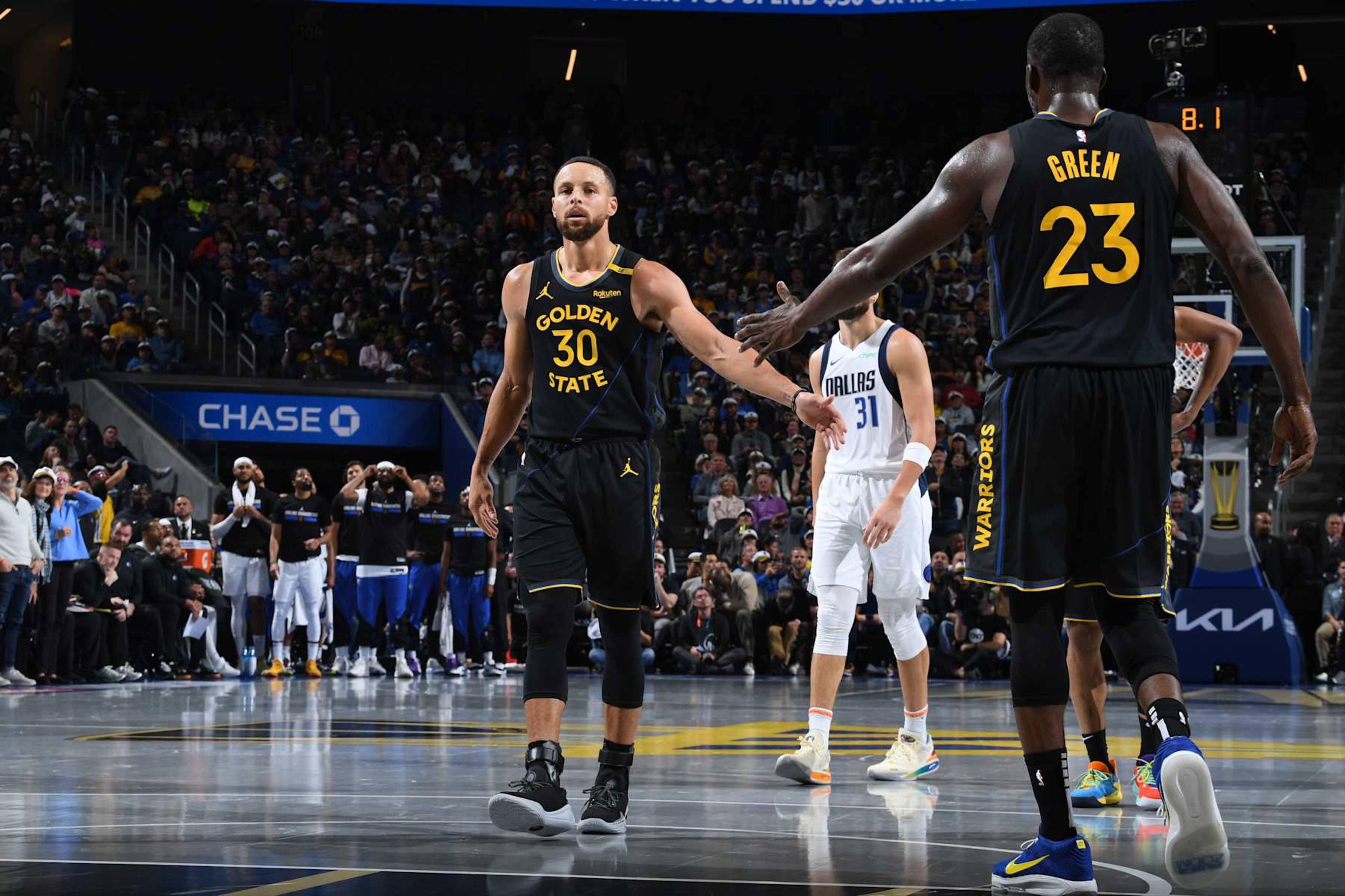 SAN FRANCISCO, CA - NOVEMBER 12: Stephen Curry #30 and Draymond Green #23 of the Golden State Warriors high five during the game against the Dallas Mavericks during the Emirates NBA Cup game on November 12, 2024 at Chase Center in San Francisco, California. NOTE TO USER: User expressly acknowledges and agrees that, by downloading and or using this photograph, user is consenting to the terms and conditions of Getty Images License Agreement. Mandatory Copyright Notice: Copyright 2024 NBAE (Photo by Noah Graham/NBAE via Getty Images)