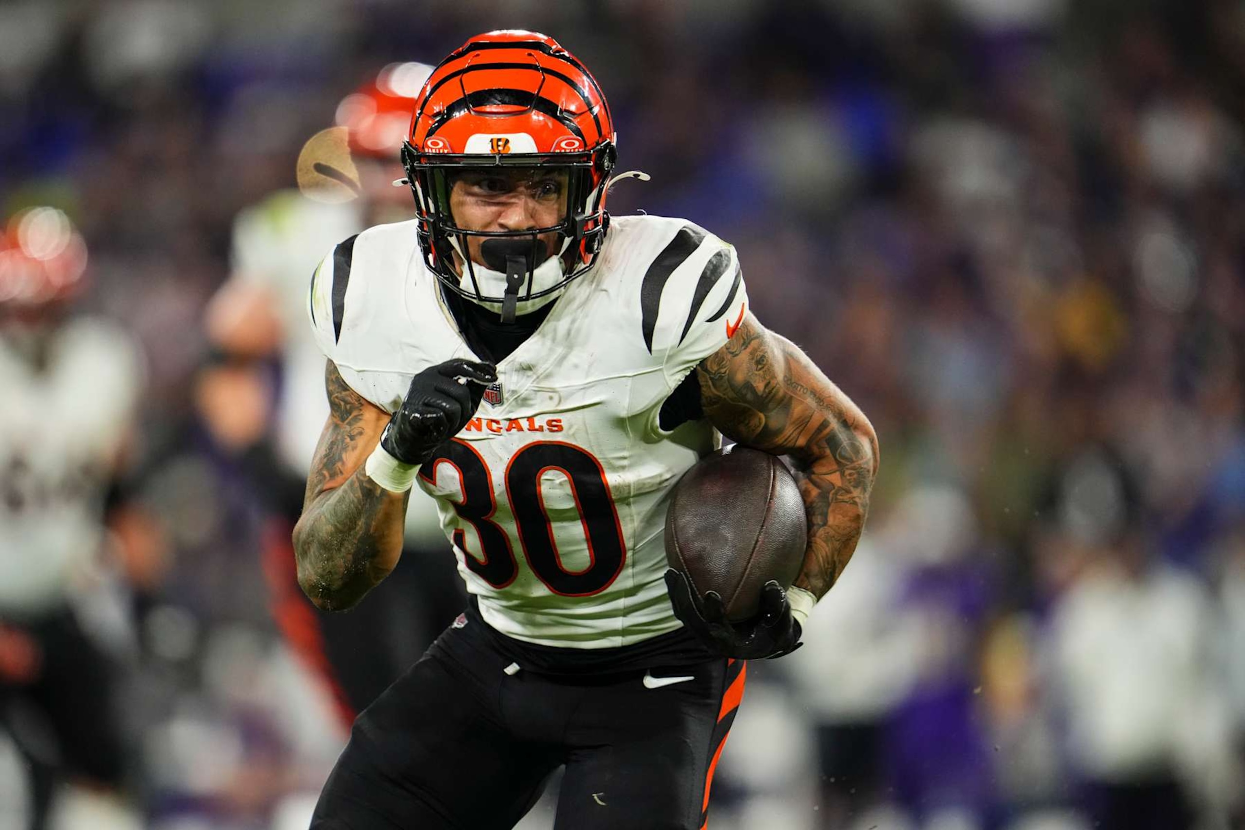 BALTIMORE, MD - NOVEMBER 07: Chase Brown #30 of the Cincinnati Bengals runs the ball during an NFL football game against the Baltimore Ravens at M&T Bank Stadium on November 7, 2024 in Baltimore, Maryland. (Photo by Cooper Neill/Getty Images)