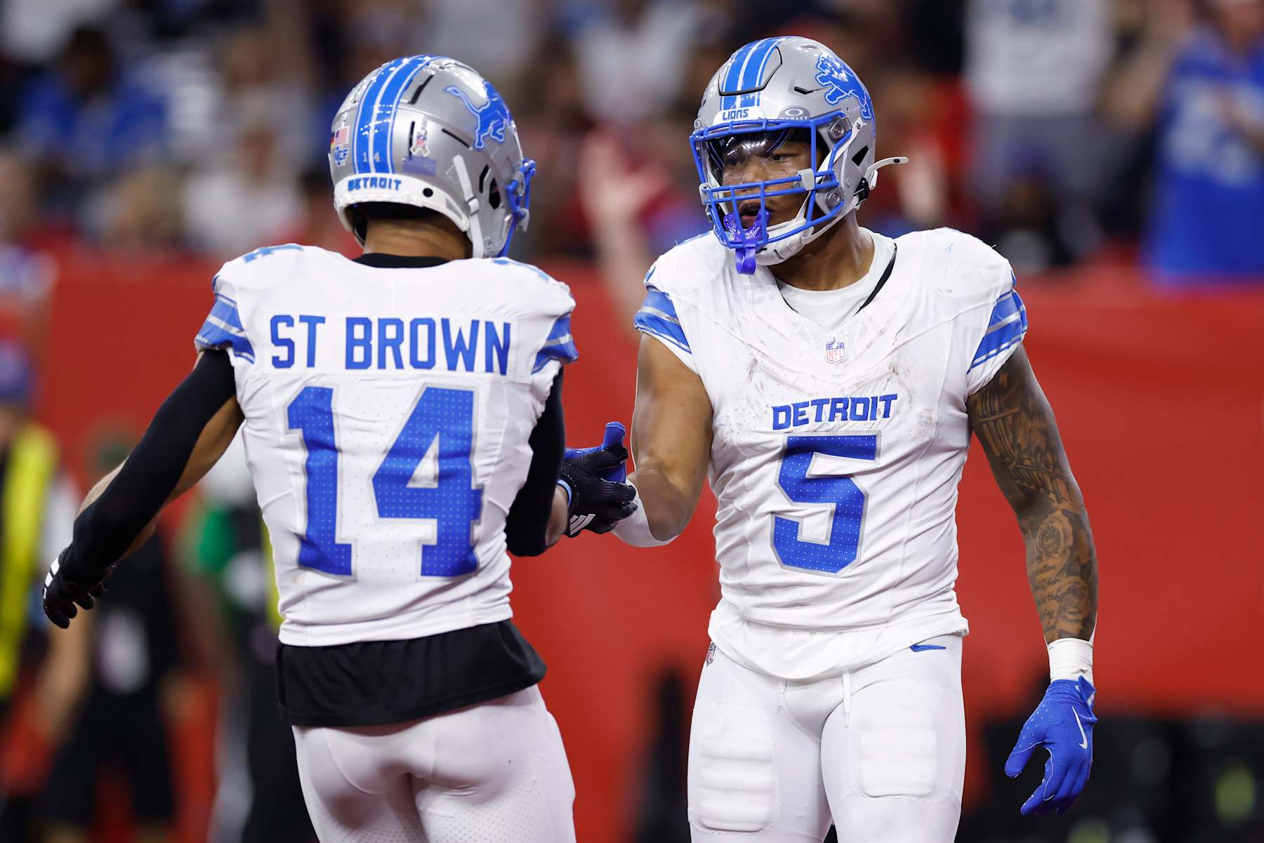Lions WR Amon-Ra St. Brown (left) and RB David Montgomery (right)
