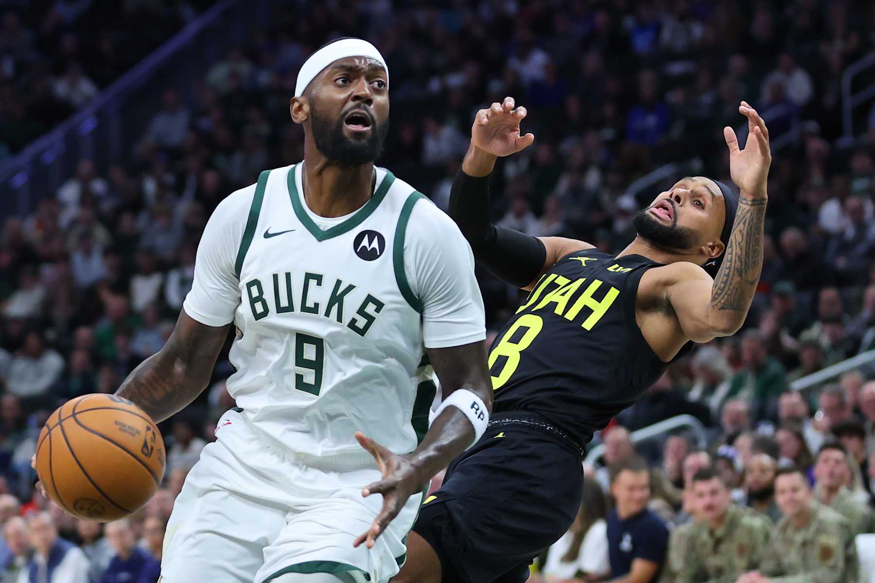 MILWAUKEE, WISCONSIN - NOVEMBER 07: Bobby Portis #9 of the Milwaukee Bucks is defended by Patty Mills #8 of the Utah Jazz during the first half of a game at Fiserv Forum on November 07, 2024 in Milwaukee, Wisconsin.  NOTE TO USER: User expressly acknowledges and agrees that, by downloading and or using this photograph, User is consenting to the terms and conditions of the Getty Images License Agreement. (Photo by Stacy Revere/Getty Images)