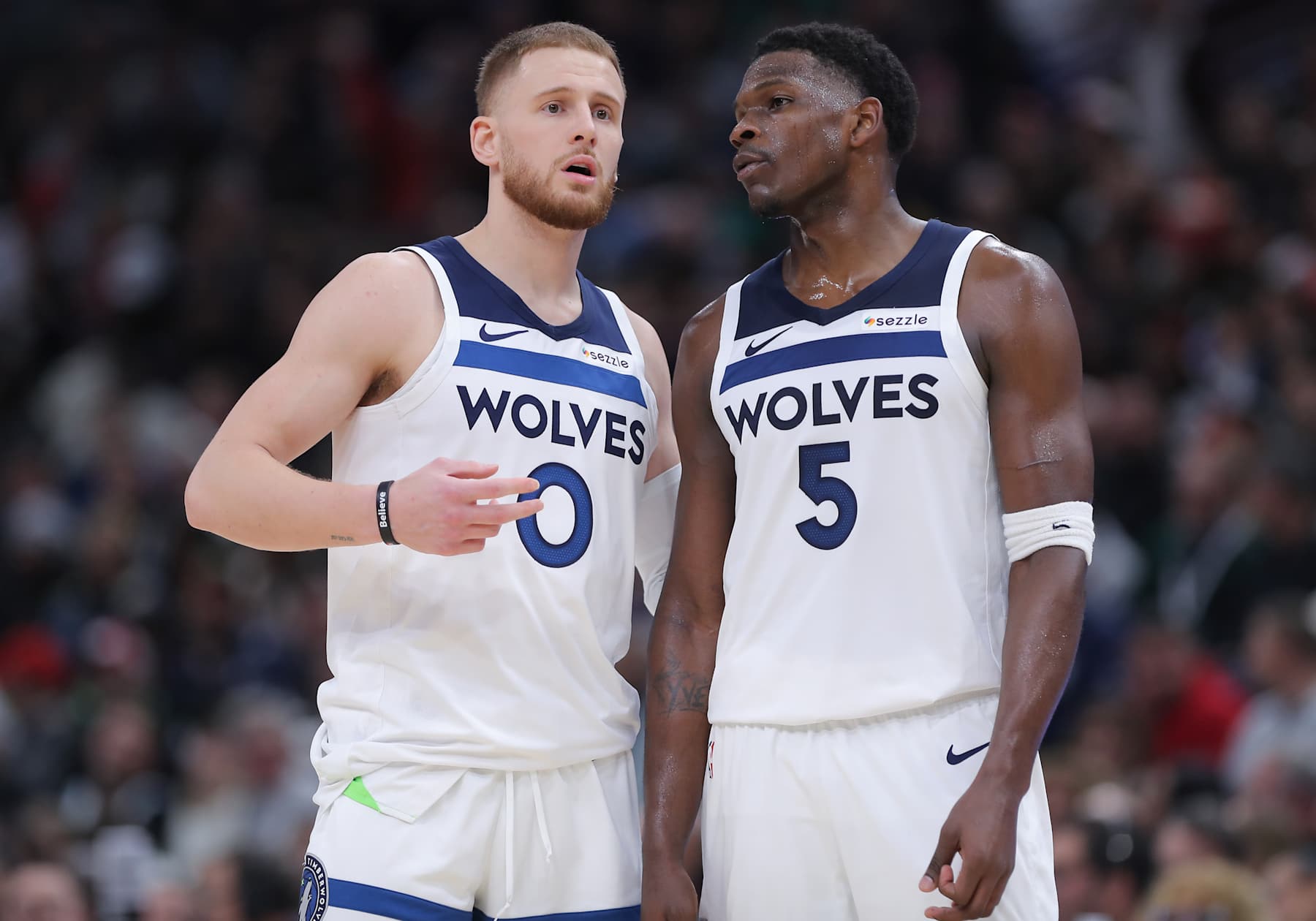 CHICAGO, IL - NOVEMBER 07: Minnesota Timberwolves guard Donte DiVincenzo (0) and Minnesota Timberwolves guard Anthony Edwards (5) chat during the second half against the Chicago Bulls on November 7, 2024 at the United Center in Chicago, Illinois. (Photo by Melissa Tamez/Icon Sportswire via Getty Images)
