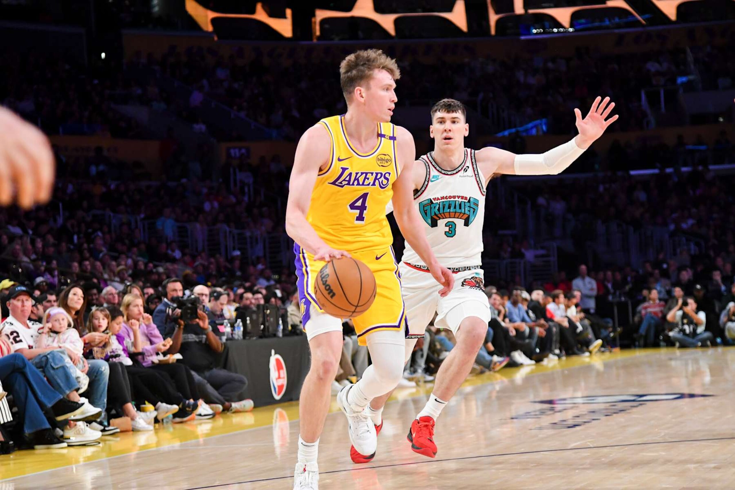 LOS ANGELES, CA - OCTOBER 22: Dalton Knecht #4 of the Los Angeles Lakers dribbles the ball during the game against the Memphis Grizzlies on October 22, 2024 at Crypto.com Arena in Los Angeles, California. NOTE TO USER: User expressly acknowledges and agrees that, by downloading and/or using this Photograph, user is consenting to the terms and conditions of the Getty Images License Agreement. Mandatory Copyright Notice: Copyright 2024 NBAE (Photo by Juan Ocampo/NBAE via Getty Images) LOS ANGELES, CA - OCTOBER 22: Dalton Knecht #4 of the Los Angeles Lakers dribbles the ball during the game against the Memphis Grizzlies on October 22, 2024 at Crypto.com Arena in Los Angeles, California. NOTE TO USER: User expressly acknowledges and agrees that, by downloading and/or using this Photograph, user is consenting to the terms and conditions of the Getty Images License Agreement. Mandatory Copyright Notice: Copyright 2024 NBAE (Photo by Juan Ocampo/NBAE via Getty Images)