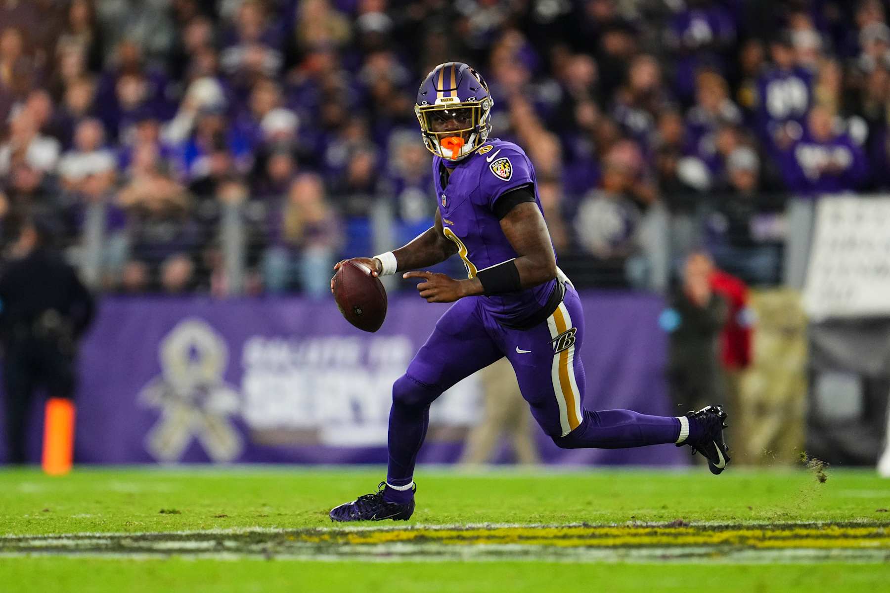 BALTIMORE, MD - NOVEMBER 07: Lamar Jackson #8 of the Baltimore Ravens scrambles out of the pocket during an NFL football game against the Cincinnati Bengals at M&T Bank Stadium on November 7, 2024 in Baltimore, Maryland. (Photo by Cooper Neill/Getty Images)