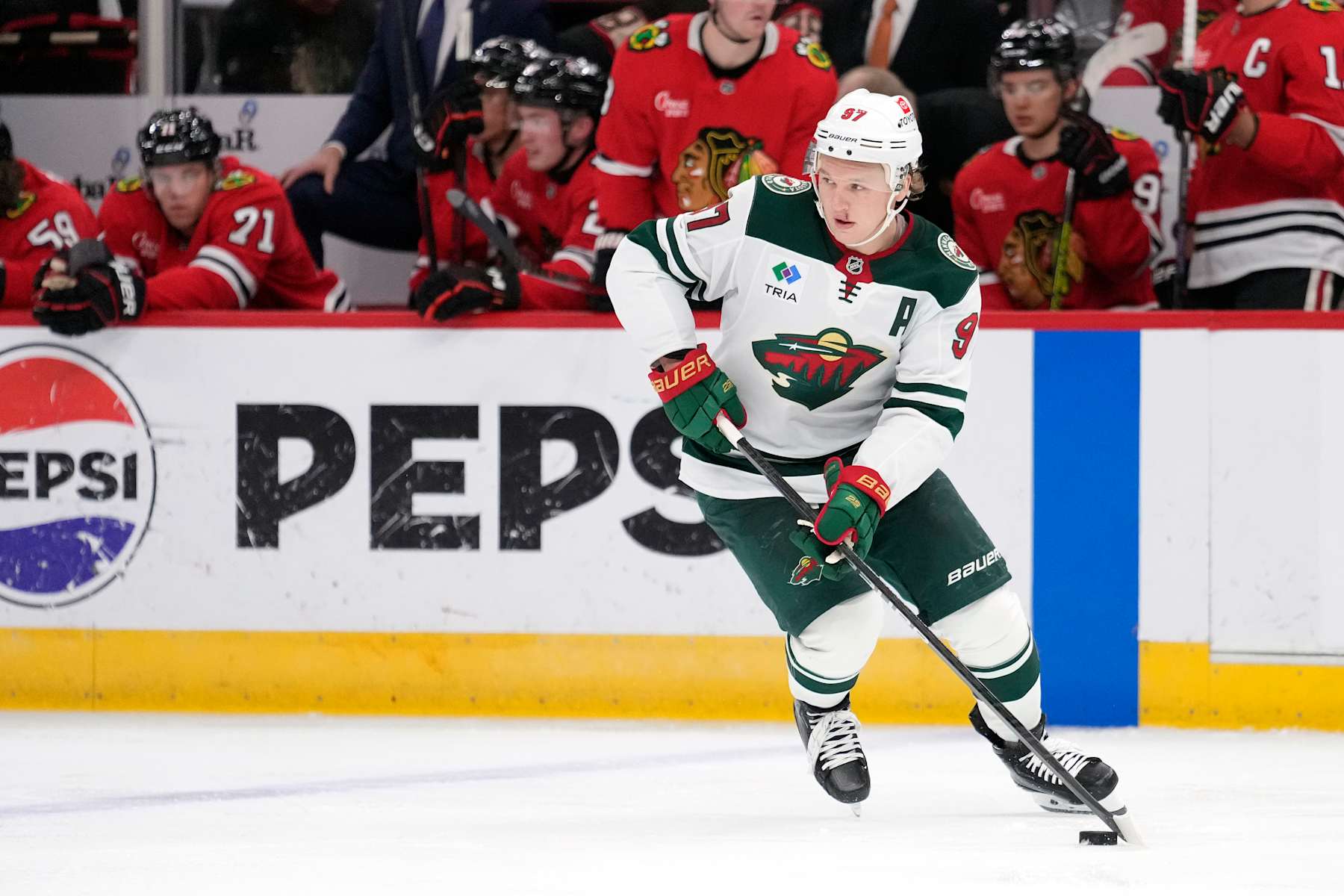 CHICAGO, ILLINOIS - NOVEMBER 10: Kirill Kaprizov #97 of the Minnesota Wild skates with the puck against the Chicago Blackhawks during the second period at the United Center on November 10, 2024 in Chicago, Illinois. (Photo by Patrick McDermott/Getty Images)