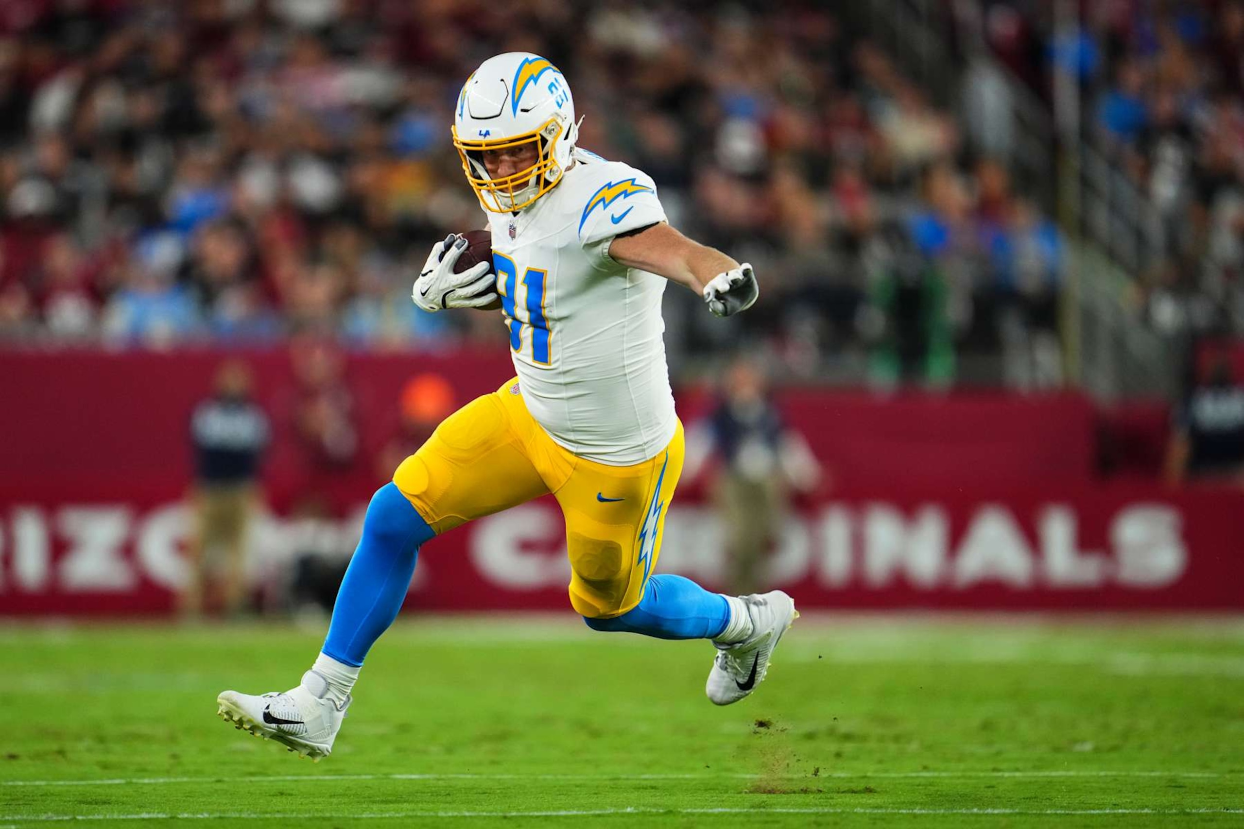 GLENDALE, AZ - OCTOBER 21: Will Dissly #81 of the Los Angeles Chargers runs the ball during an NFL football game against the Arizona Cardinals at State Farm Stadium on October 21, 2024 in Glendale, Arizona. (Photo by Cooper Neill/Getty Images) GLENDALE, AZ - OCTOBER 21: Will Dissly #81 of the Los Angeles Chargers runs the ball during an NFL football game against the Arizona Cardinals at State Farm Stadium on October 21, 2024 in Glendale, Arizona. (Photo by Cooper Neill/Getty Images)