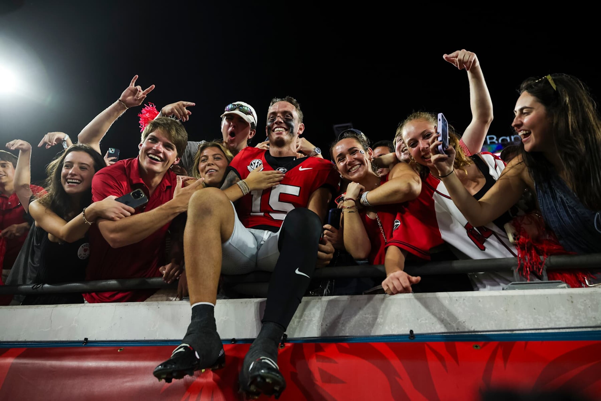 JACKSONVILLE, FLORIDA - NOVEMBER 02: Carson Beck #15 of the Georgia Bulldogs celebrates with fans after a game against the Florida Gators at EverBank Stadium on November 02, 2024 in Jacksonville, Florida. (Photo by James Gilbert/Getty Images)
