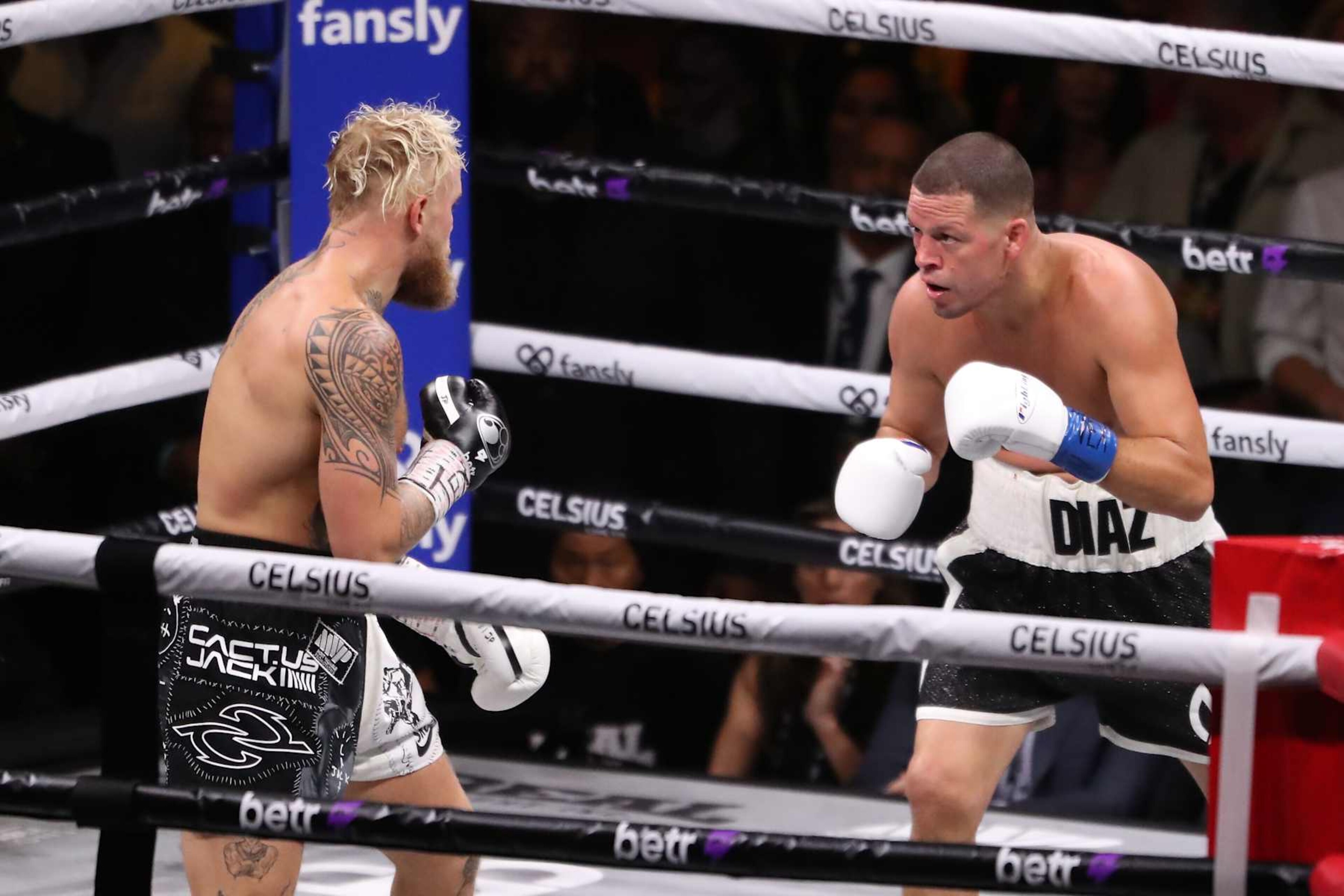 Jake Paul and Nate Diaz square off in the boxing ring Jake Paul and Nate Diaz square off in the boxing ring