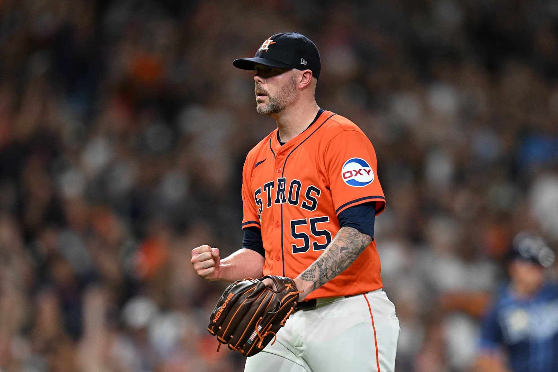 HOUSTON, TEXAS - AUGUST 2: Ryan Pressly #55 of the Houston Astros reacts after inducing an inning ending ground out against the Tampa Bay Rays during the eighth inning at Minute Maid Park on August 2, 2024 in Houston, Texas. (Photo by Jack Gorman/Getty Images)