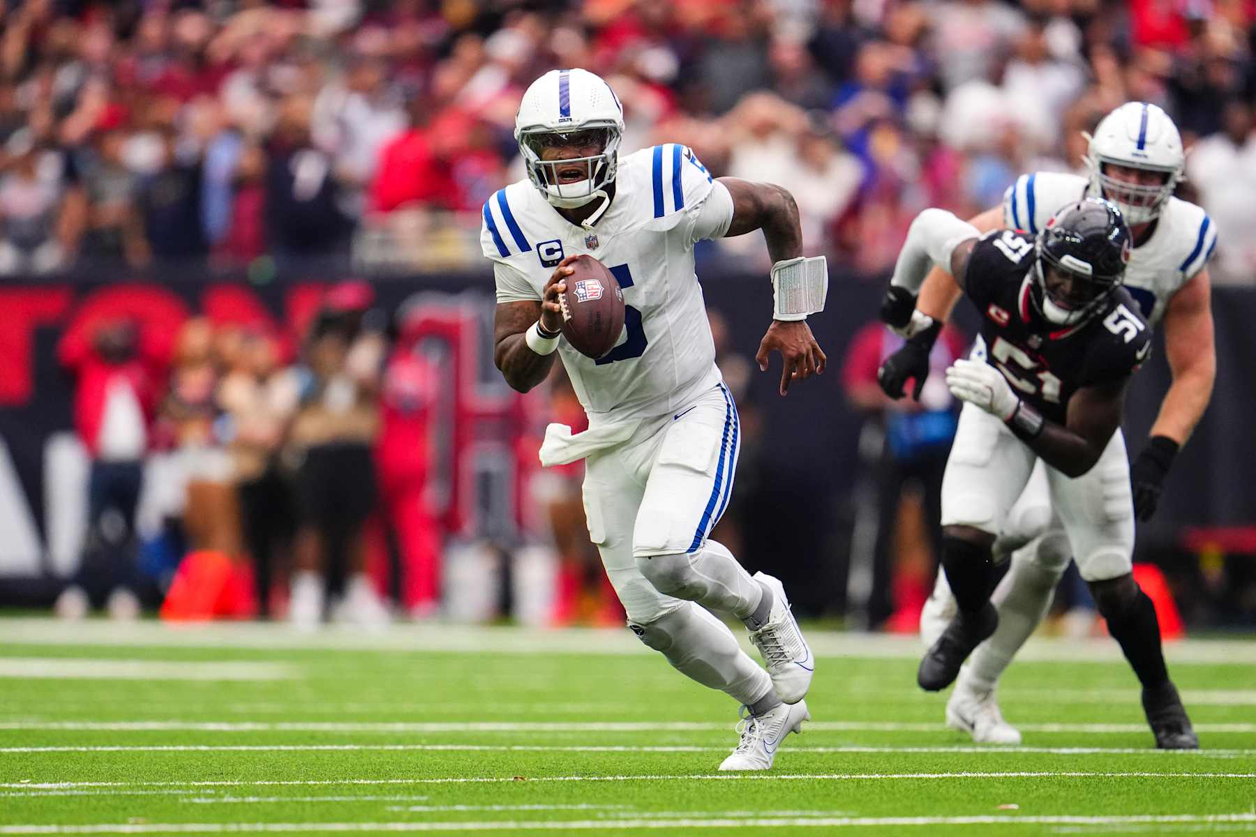 HOUSTON, TX - OCTOBER 27: Anthony Richardson #5 of the Indianapolis Colts scrambles out of the pocket during an NFL football game against the Houston Texans at NRG Stadium on October 27, 2024 in Houston, Texas. (Photo by Cooper Neill/Getty Images)