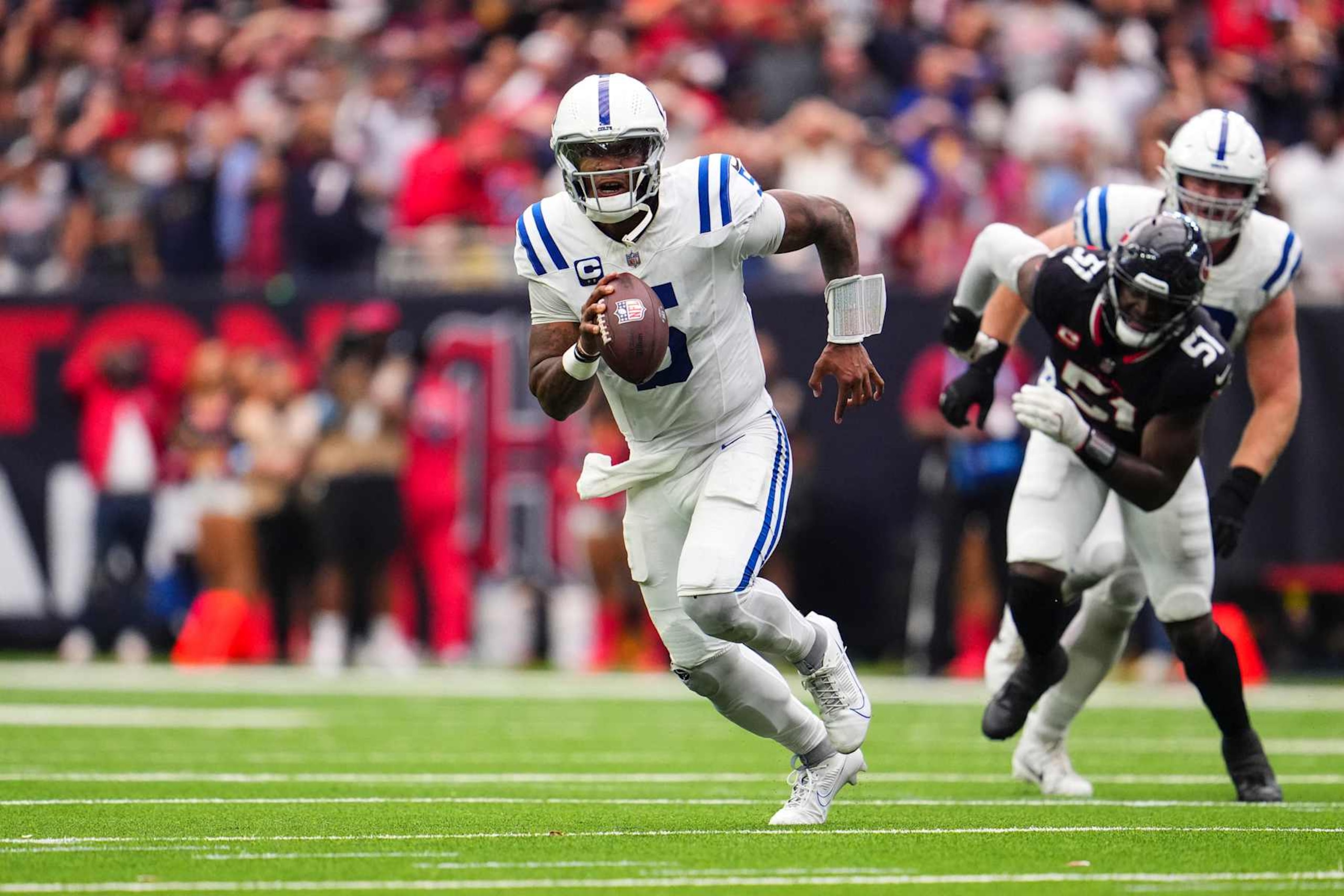 HOUSTON, TX - OCTOBER 27: Anthony Richardson #5 of the Indianapolis Colts scrambles out of the pocket during an NFL football game against the Houston Texans at NRG Stadium on October 27, 2024 in Houston, Texas. (Photo by Cooper Neill/Getty Images)