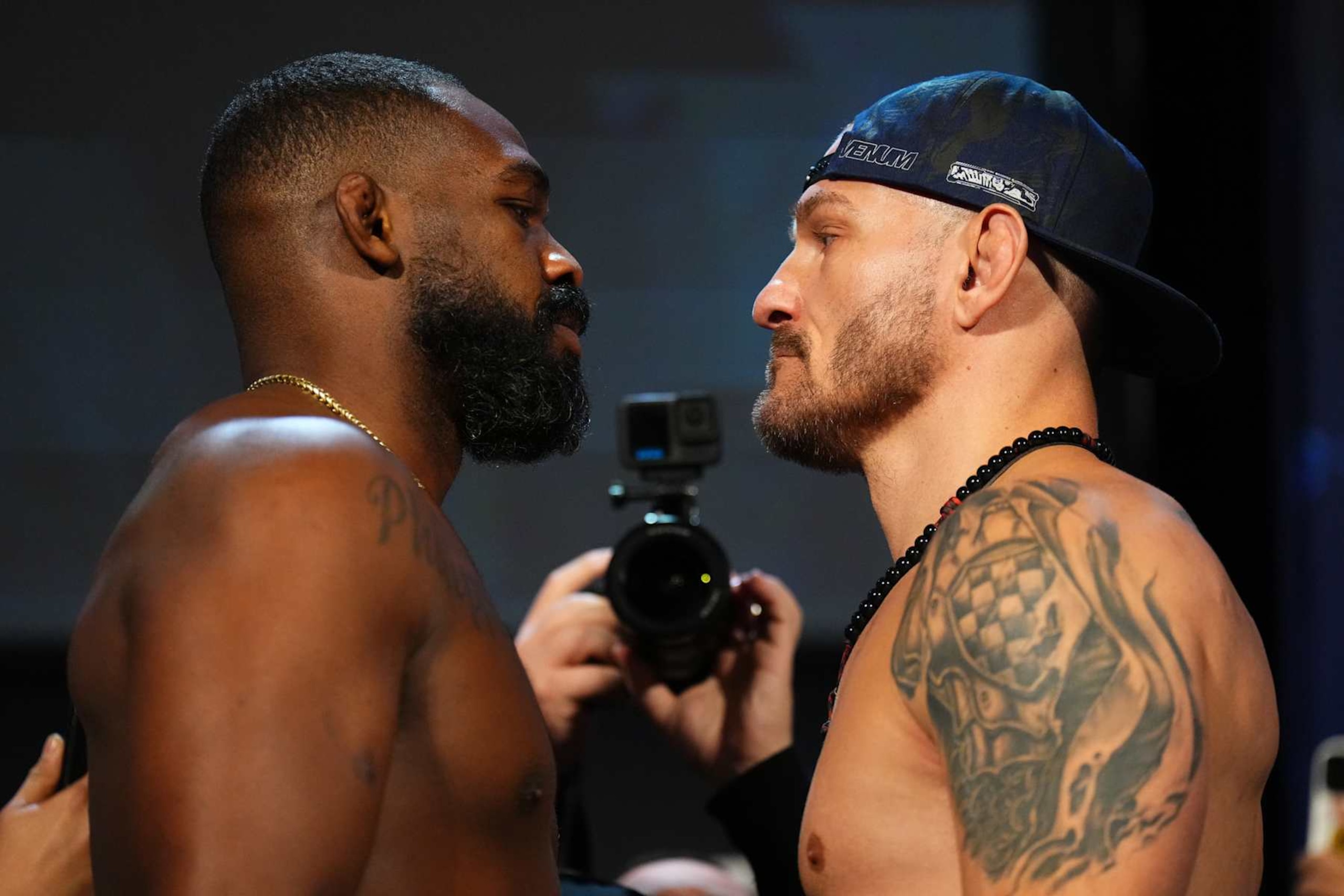 NEW YORK, NEW YORK - NOVEMBER 15: (L-R) Opponents Jon Jones and Stipe Miocic face off during the UFC 309 ceremonial weigh-in at The Theater at Madison Square Garden on November 15, 2024 in New York City. (Photo by Chris Unger/Zuffa LLC)