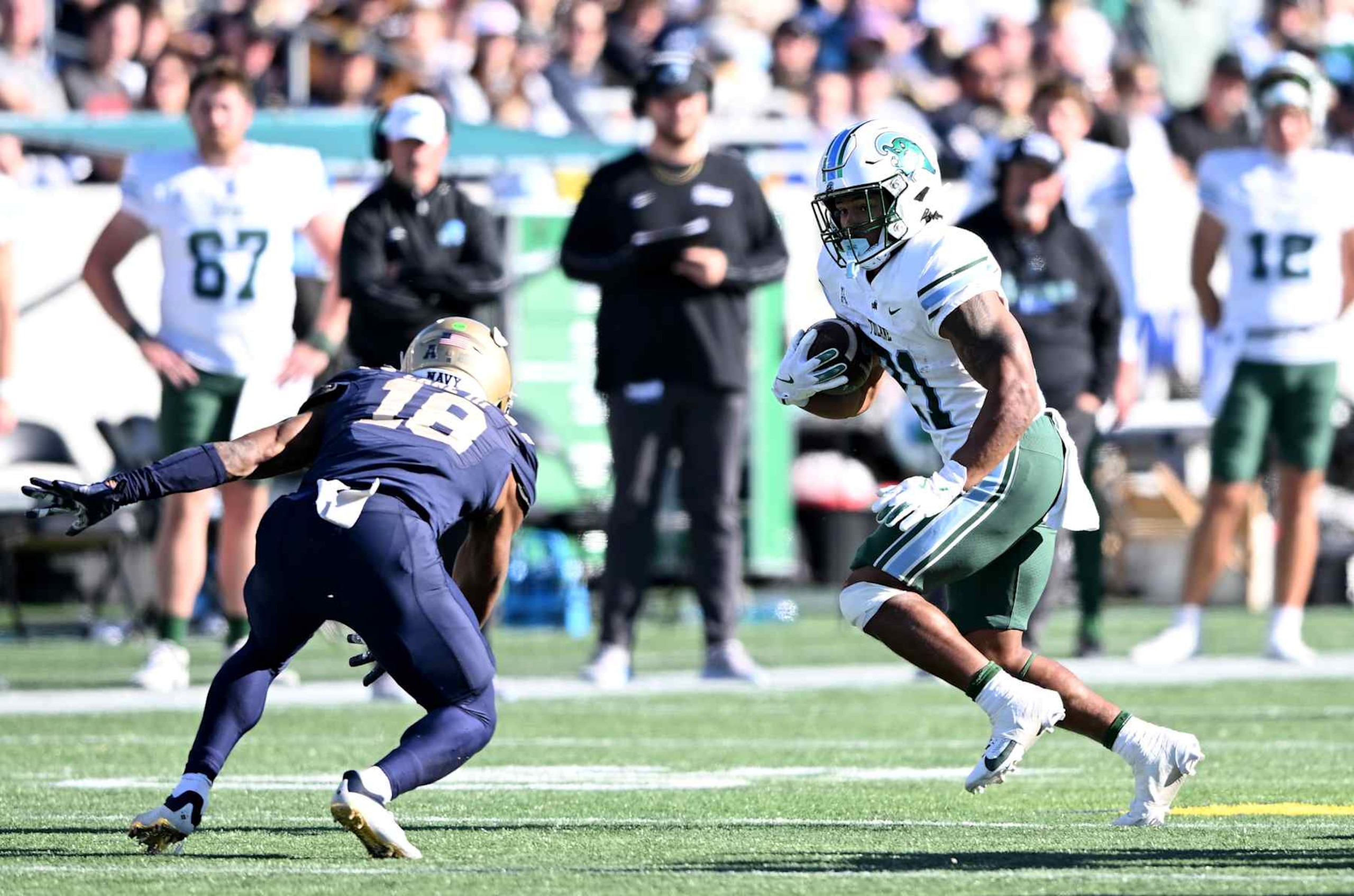 ANNAPOLIS, MARYLAND - NOVEMBER 16: Makhi Hughes #21 of the Tulane Green Wave rushes the ball in the second quarter against the Navy Midshipmen at Navy-Marine Corps Memorial Stadium on November 16, 2024 in Annapolis, Maryland. (Photo by Greg Fiume/Getty Images)