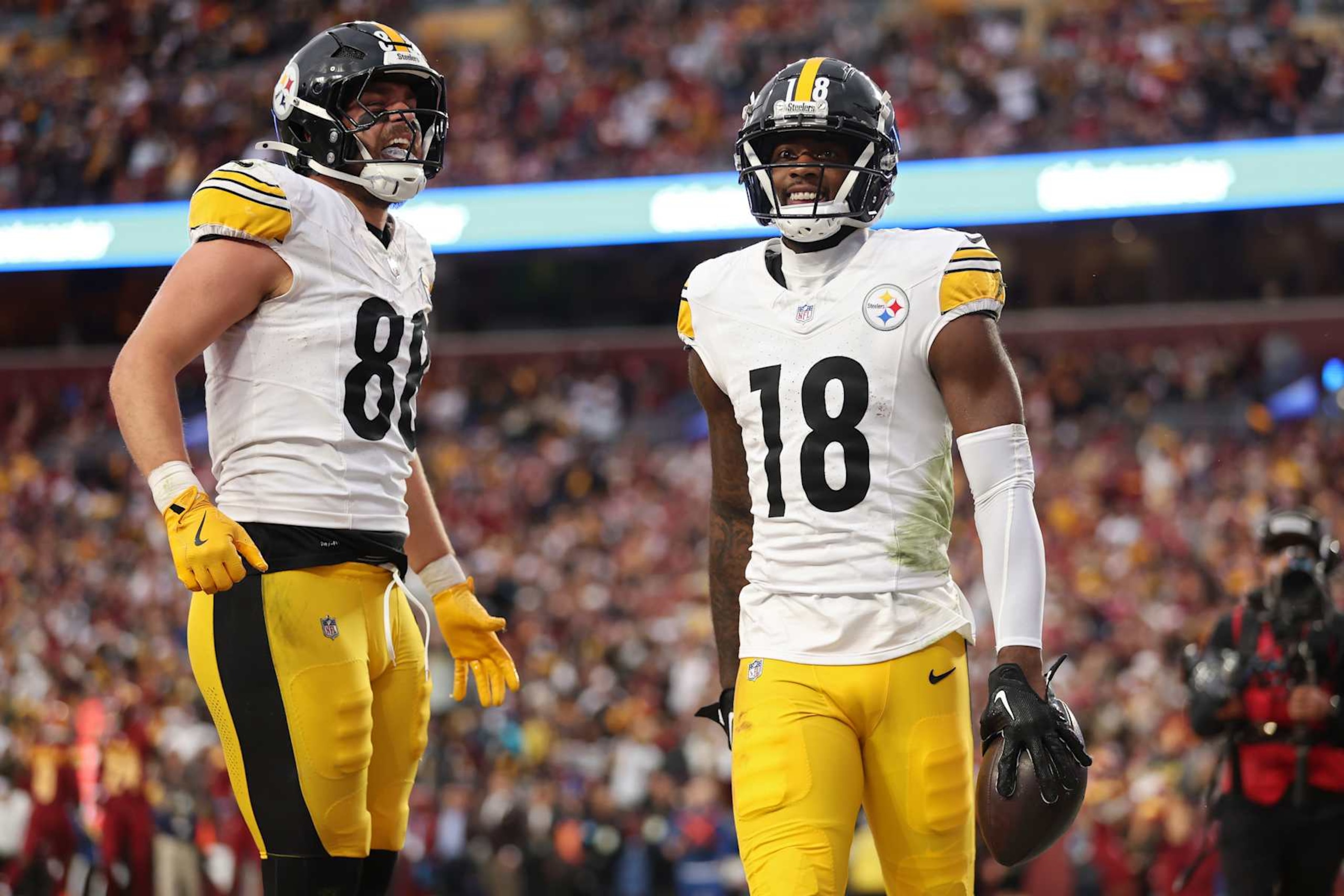 LANDOVER, MARYLAND - NOVEMBER 10: Pat Freiermuth #88 and Mike Williams #18 of the Pittsburgh Steelers celebrate after Williams' receiving touchdown in the fourth quarter of a game against the Washington Commanders at Northwest Stadium on November 10, 2024 in Landover, Maryland. (Photo by Patrick Smith/Getty Images)