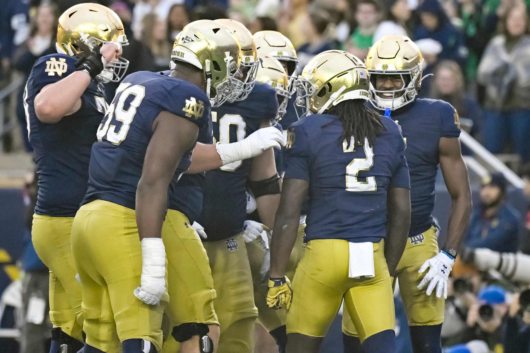 SOUTH BEND, INDIANA - NOVEMBER 16: Jayden Harrison #2 of the Notre Dame Fighting Irish celebrates a touchdown with teammates in the first half against the Virginia Cavaliers at Notre Dame Stadium on November 16, 2024 in South Bend, Indiana. (Photo by Quinn Harris/Getty Images)