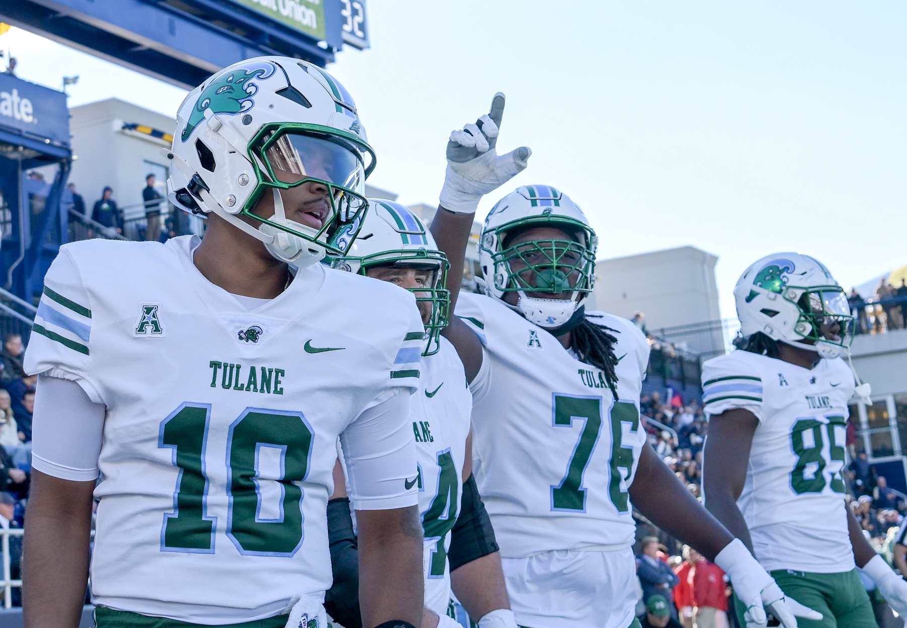 ANNAPOLIS, MD - NOVEMBER 16:  Tulane Green Wave quarterback Darian Mensah (10) reacts after his rushing touchdown with offensive lineman Derrick Graham (76) during the Tulane Green Wave game versus the Naval Academy Midshipmen on November 16, 2024 at Navy - Marine Corps Memorial Stadium in Annapolis, MD. (Photo by Mark Goldman/Icon Sportswire via Getty Images)