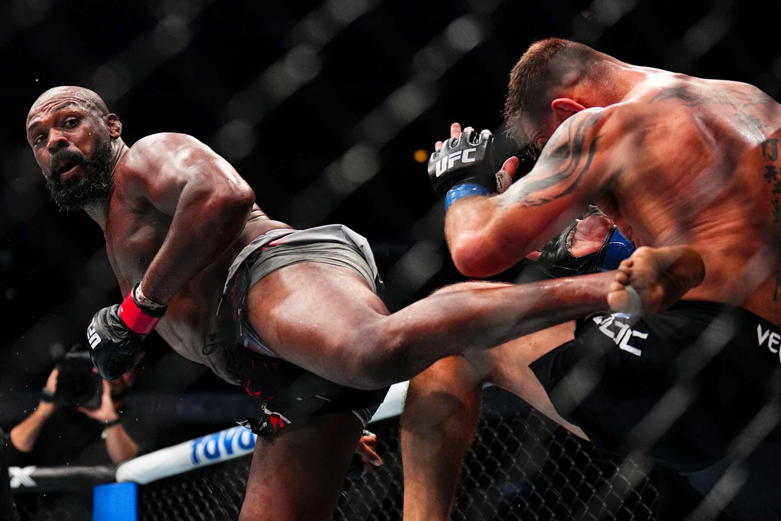 Jon Jones lands a spinning back kick against Stipe Miocic