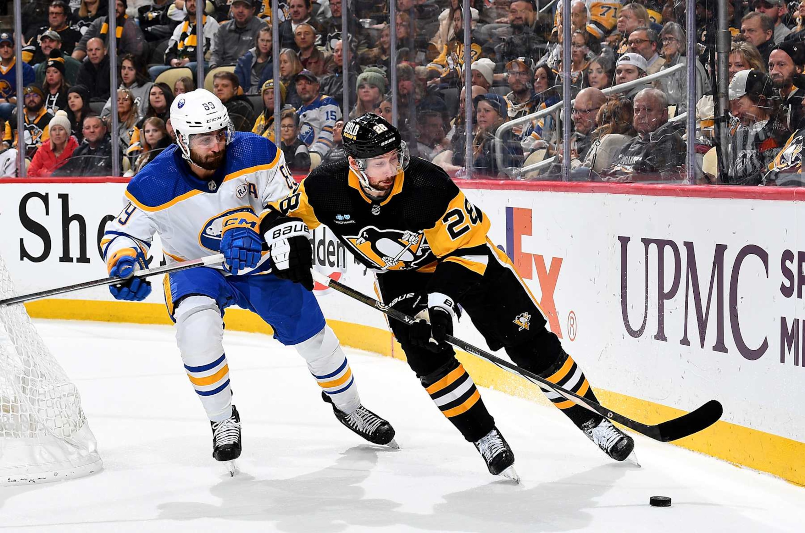 Pittsburgh Penguins defenseman Marcus Pettersson (right) and Buffalo Sabres forward Alex Tuch. Pittsburgh Penguins defenseman Marcus Pettersson (right) and Buffalo Sabres forward Alex Tuch.
