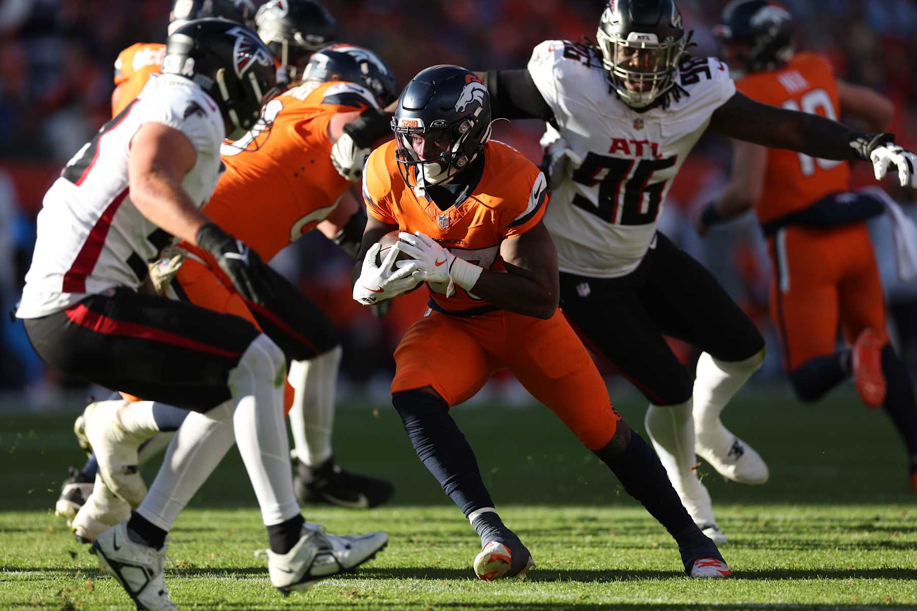 DENVER, COLORADO - NOVEMBER 17: Javonte Williams #33 of the Denver Broncos runs with the ball during the first quarter against the Atlanta Falcons at Empower Field At Mile High on November 17, 2024 in Denver, Colorado. (Photo by Matthew Stockman/Getty Images)