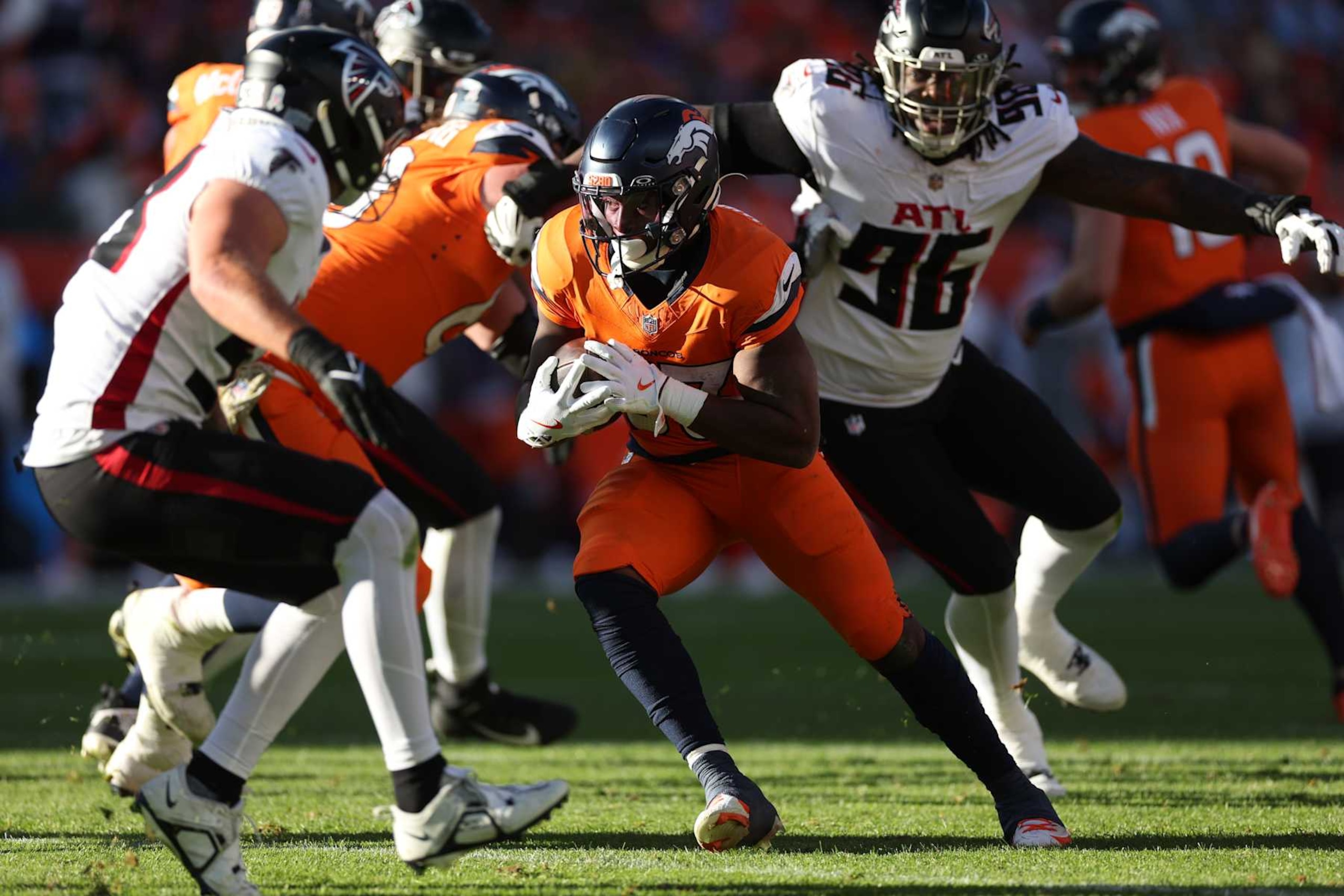 DENVER, COLORADO - NOVEMBER 17: Javonte Williams #33 of the Denver Broncos runs with the ball during the first quarter against the Atlanta Falcons at Empower Field At Mile High on November 17, 2024 in Denver, Colorado. (Photo by Matthew Stockman/Getty Images)