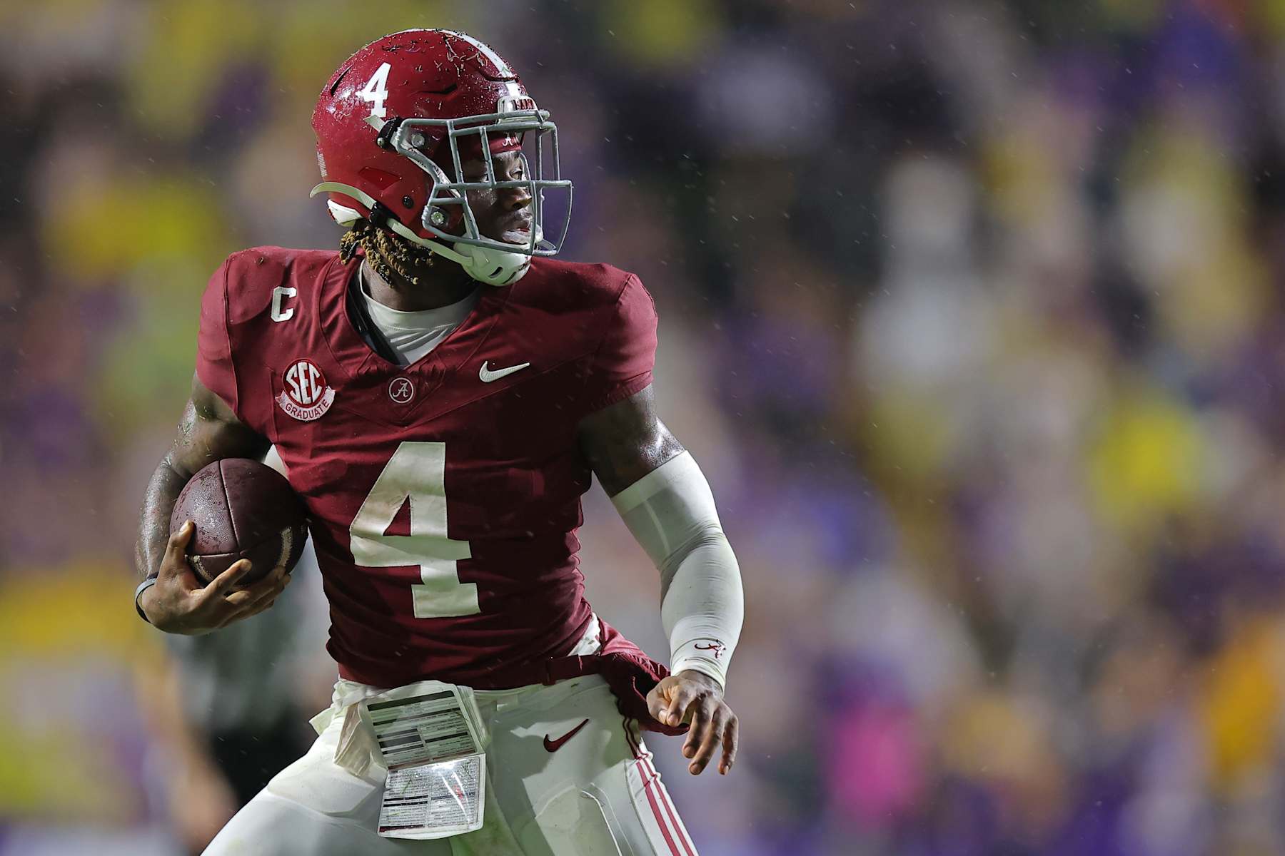 BATON ROUGE, LOUISIANA - NOVEMBER 09: Jalen Milroe #4 of the Alabama Crimson Tide runs with the ball against the LSU Tigers during a game at Tiger Stadium on November 09, 2024 in Baton Rouge, Louisiana. (Photo by Jonathan Bachman/Getty Images)