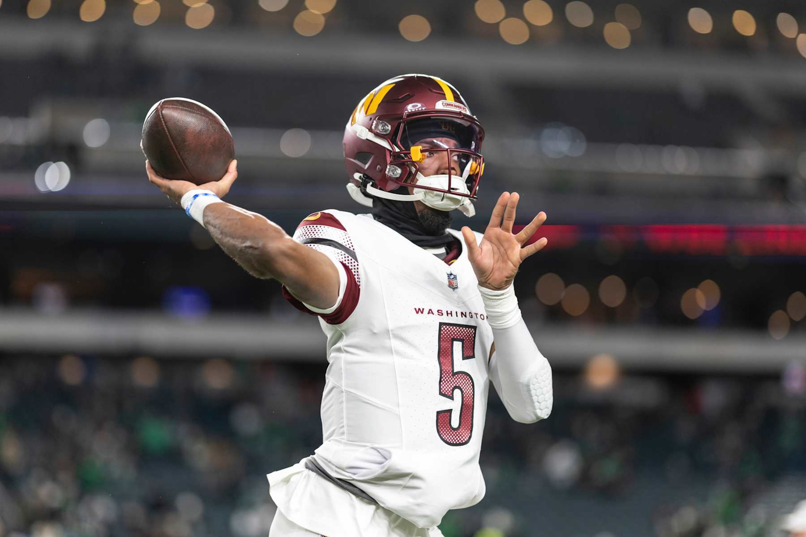 PHILADELPHIA, PENNSYLVANIA - NOVEMBER 14: Jayden Daniels #5 of the Washington Commanders looks to pass prior to an NFL Football game against the Philadelphia Eagles at Lincoln Financial Field on November 14, 2024 in Philadelphia, Pennsylvania. (Photo by Michael Owens/Getty Images)