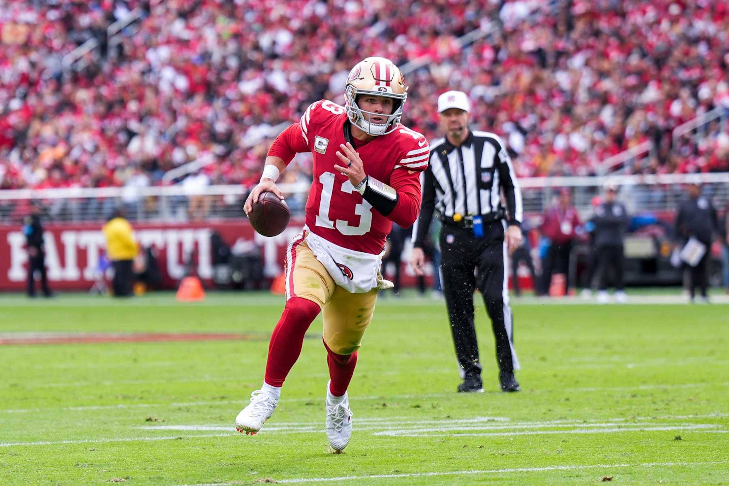 SANTA CLARA, CALIFORNIA - NOVEMBER 17: Brock Purdy #13 of the San Francisco 49ers runs the ball for a touchdown in the first quarter of a game against the Seattle Seahawks at Levi's Stadium on November 17, 2024 in Santa Clara, California. (Photo by Thearon W. Henderson/Getty Images)